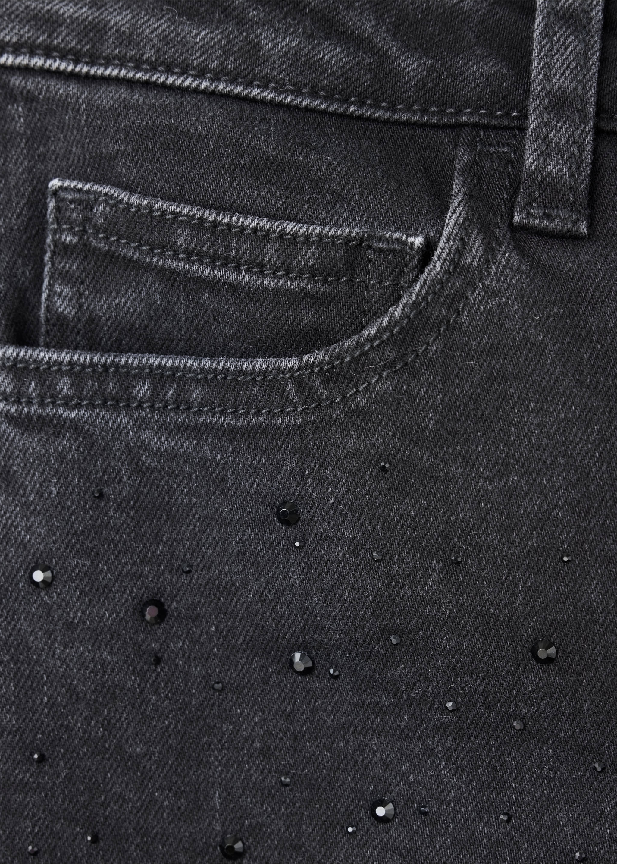 Close-up of dark grey denim trousers with rhinestone embellishments., Black denim. Ref: 37059228-00.