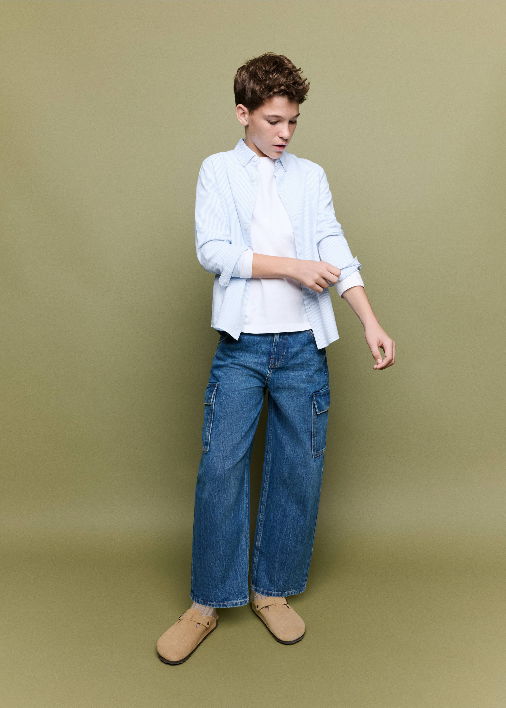 Light blue shirt worn open over a white t-shirt with blue denim cargo trousers., Sky Blue. Ref: 37061363-00.