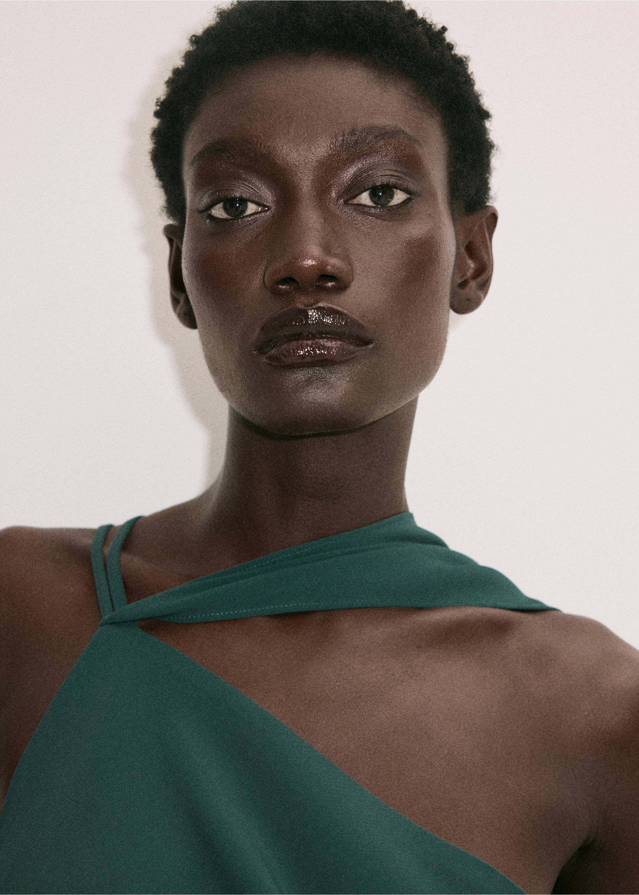 Close-up of a dark green dress with an asymmetric strap neckline on a model., Green. Ref: 37061468-00.