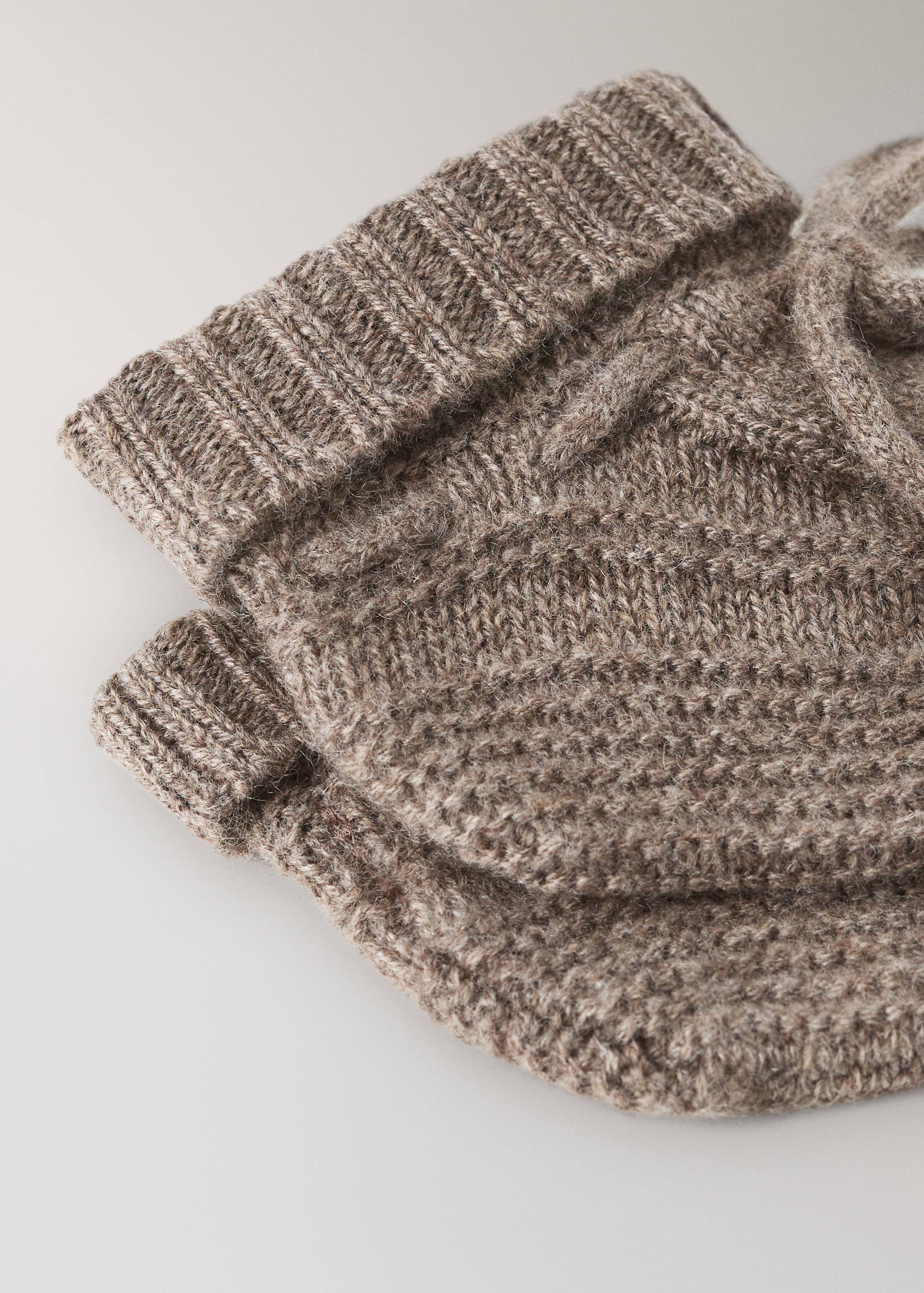 Brown cable-knit socks with ribbed cuffs.