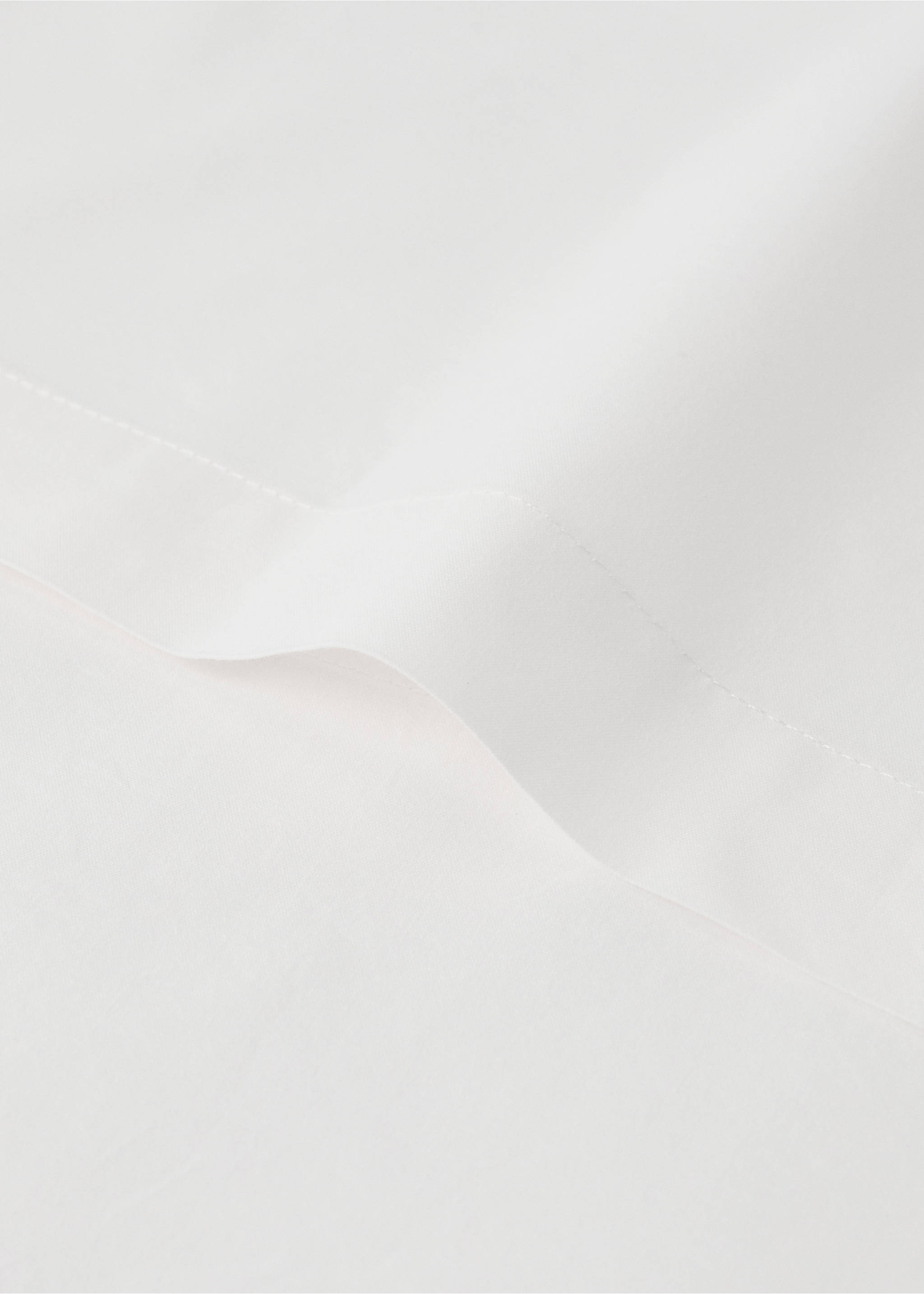 Close-up of the smooth texture and stitched border of a white duvet cover., Medium Brown. Ref: 37062559-00.