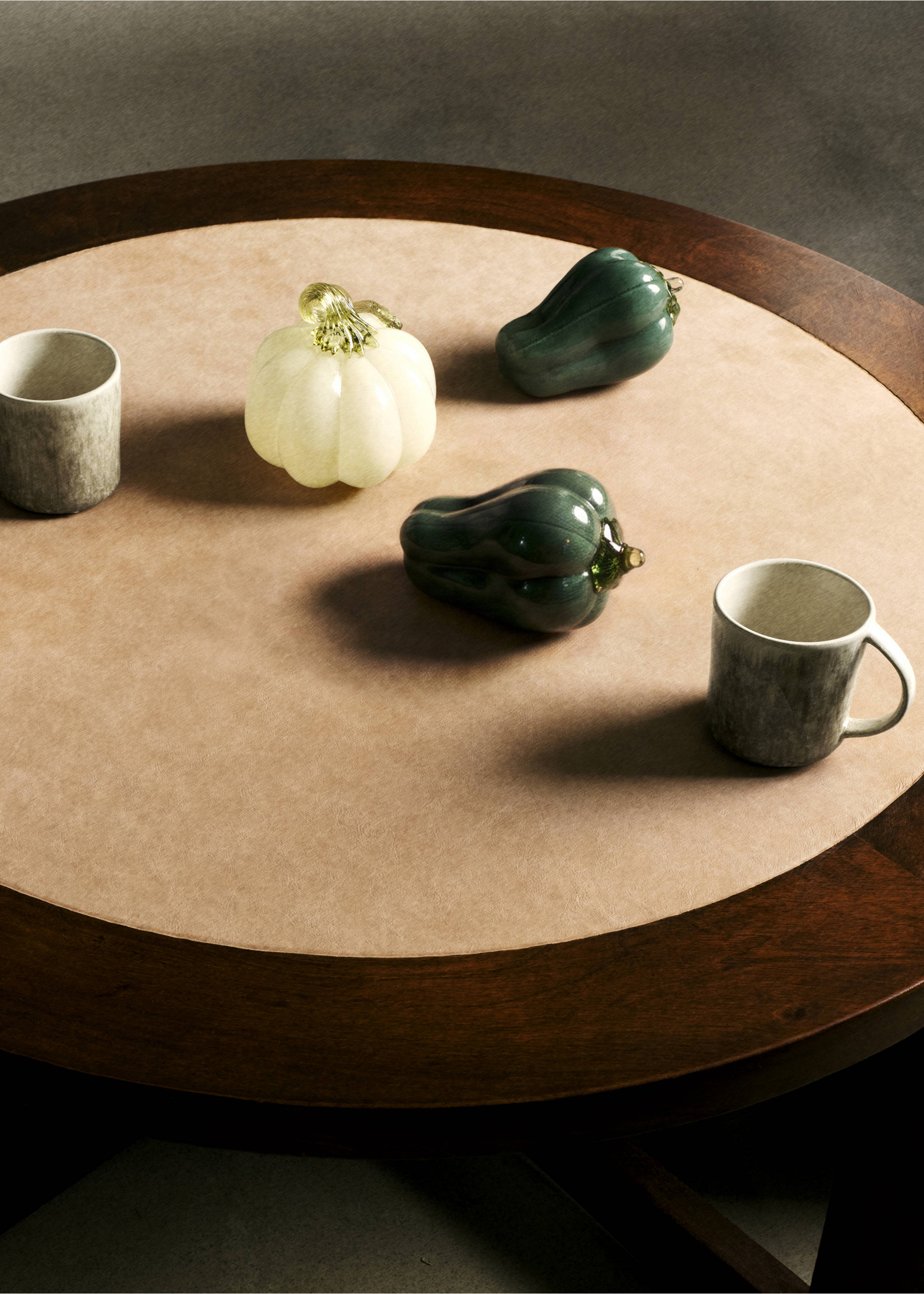 Decorative glass vegetable ornaments arranged on a round wooden table., Green. Ref: 37063281-00.
