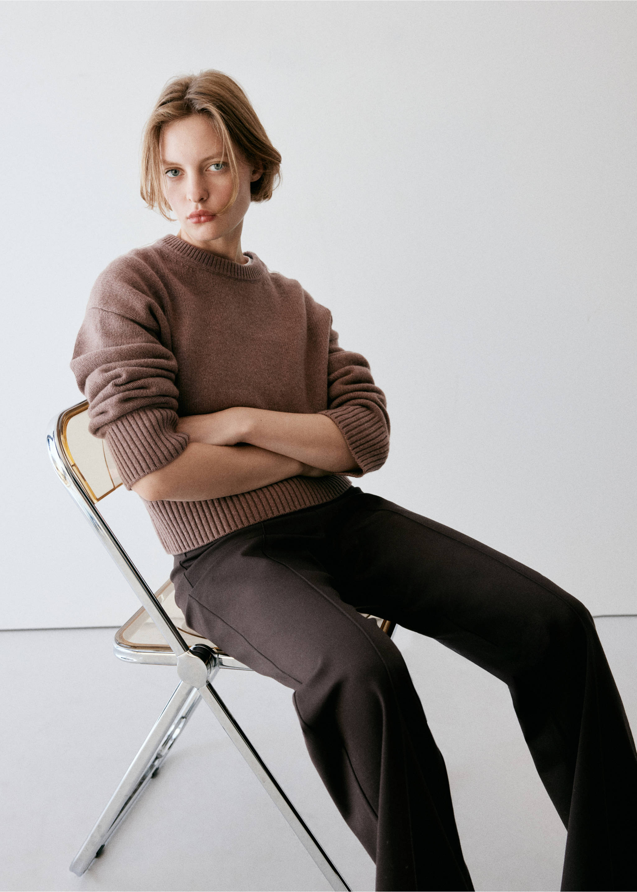 Dark brown trousers worn with a brown crew-neck knitted jumper., Brown. Ref: 37064078-00.