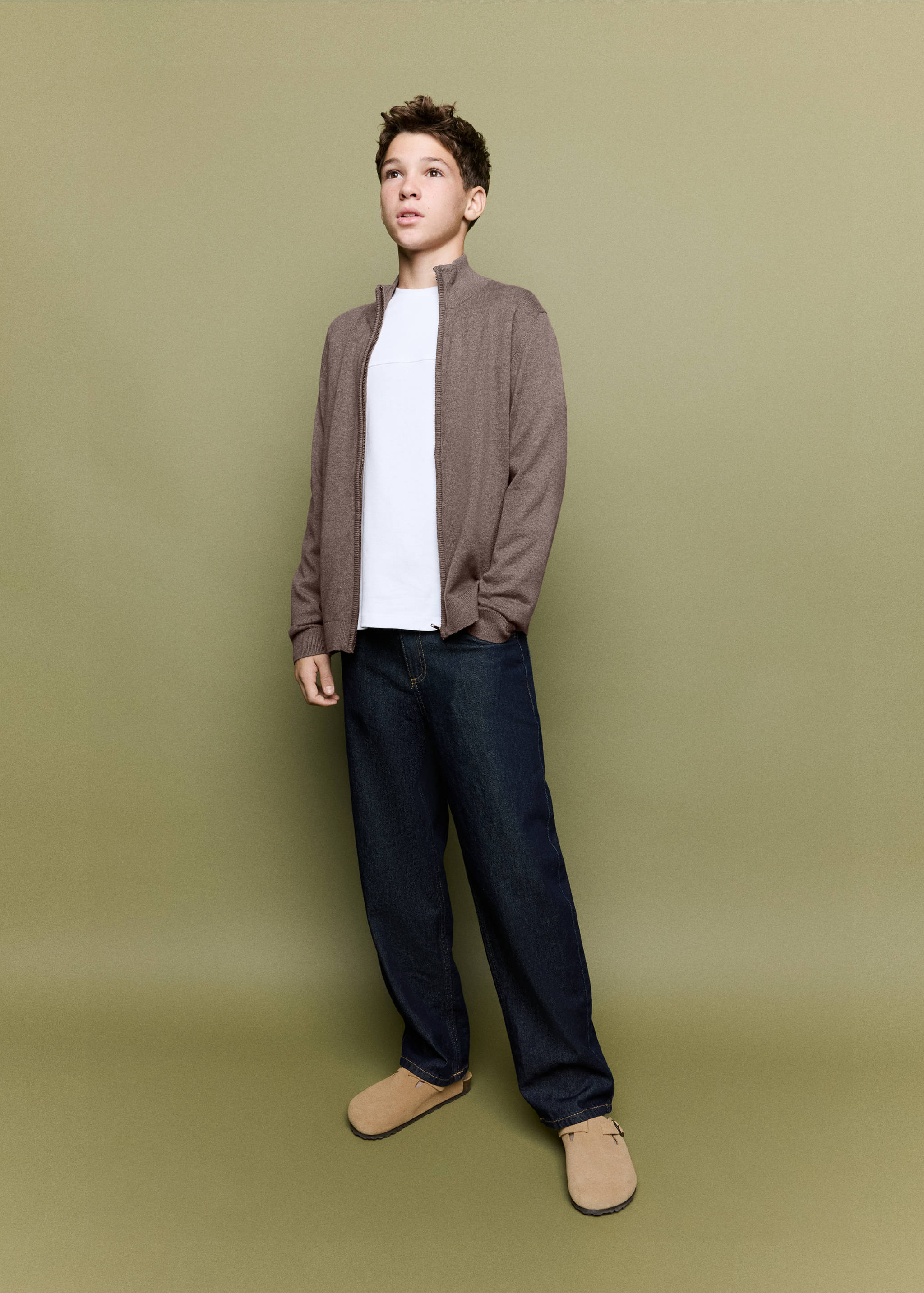 Brown zip-up cardigan worn with a white t-shirt and blue trousers., Brown. Ref: 37064403-00.