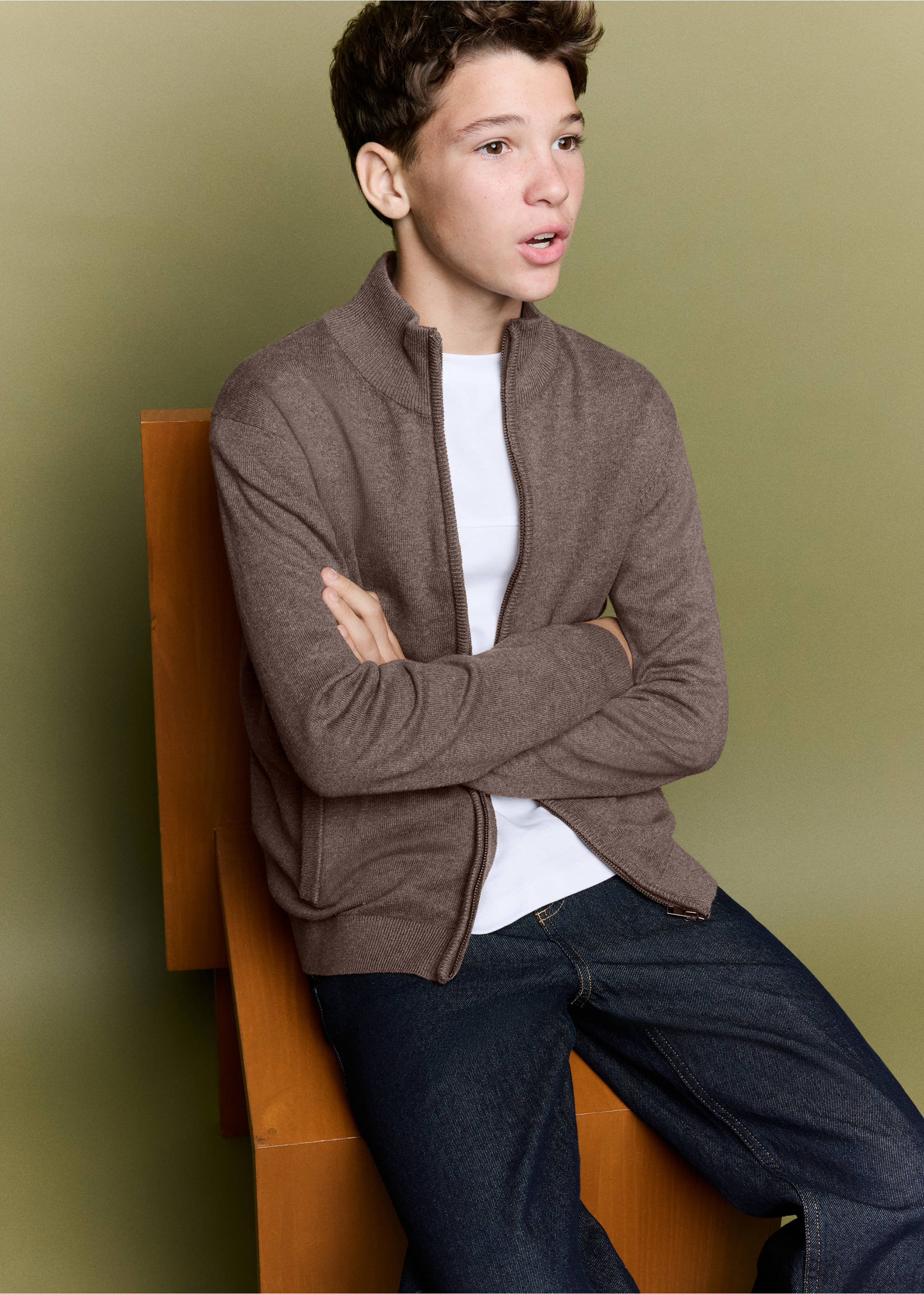 Brown knitted zip-up cardigan with high neck, worn with jeans., Brown. Ref: 37064403-00.