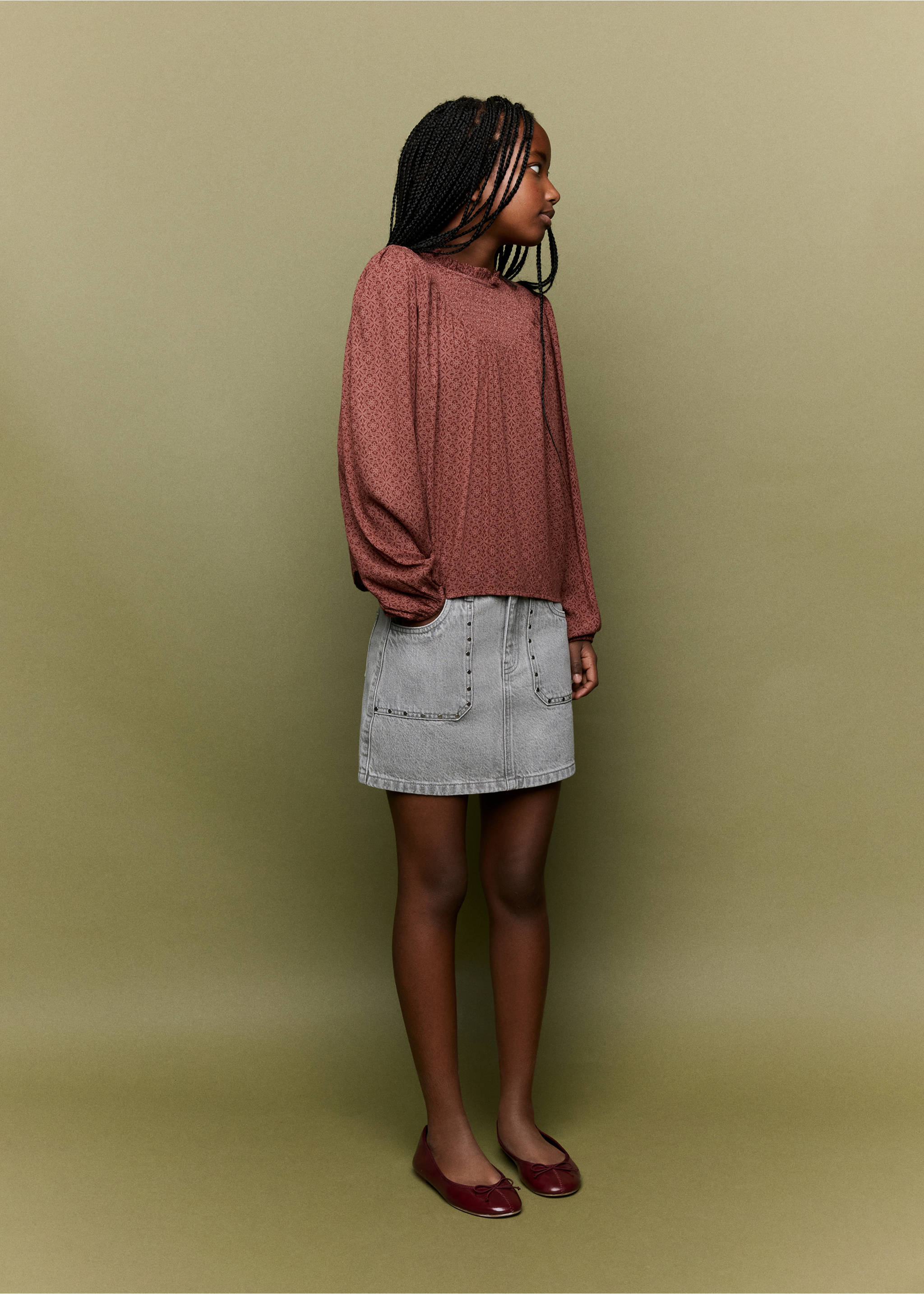 Grey denim mini skirt with front patch pockets and stud detailing, styled with a patterned blouse., Denim Grey. Ref: 37064409-00.
