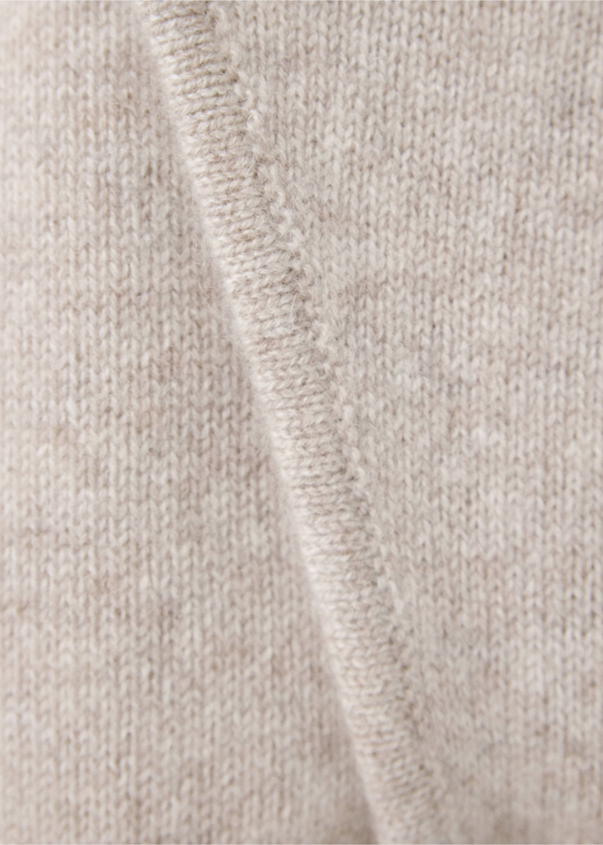 Close-up of the beige knit fabric and trim on a kids jumpsuit., Sand. Ref: 37064467-00.