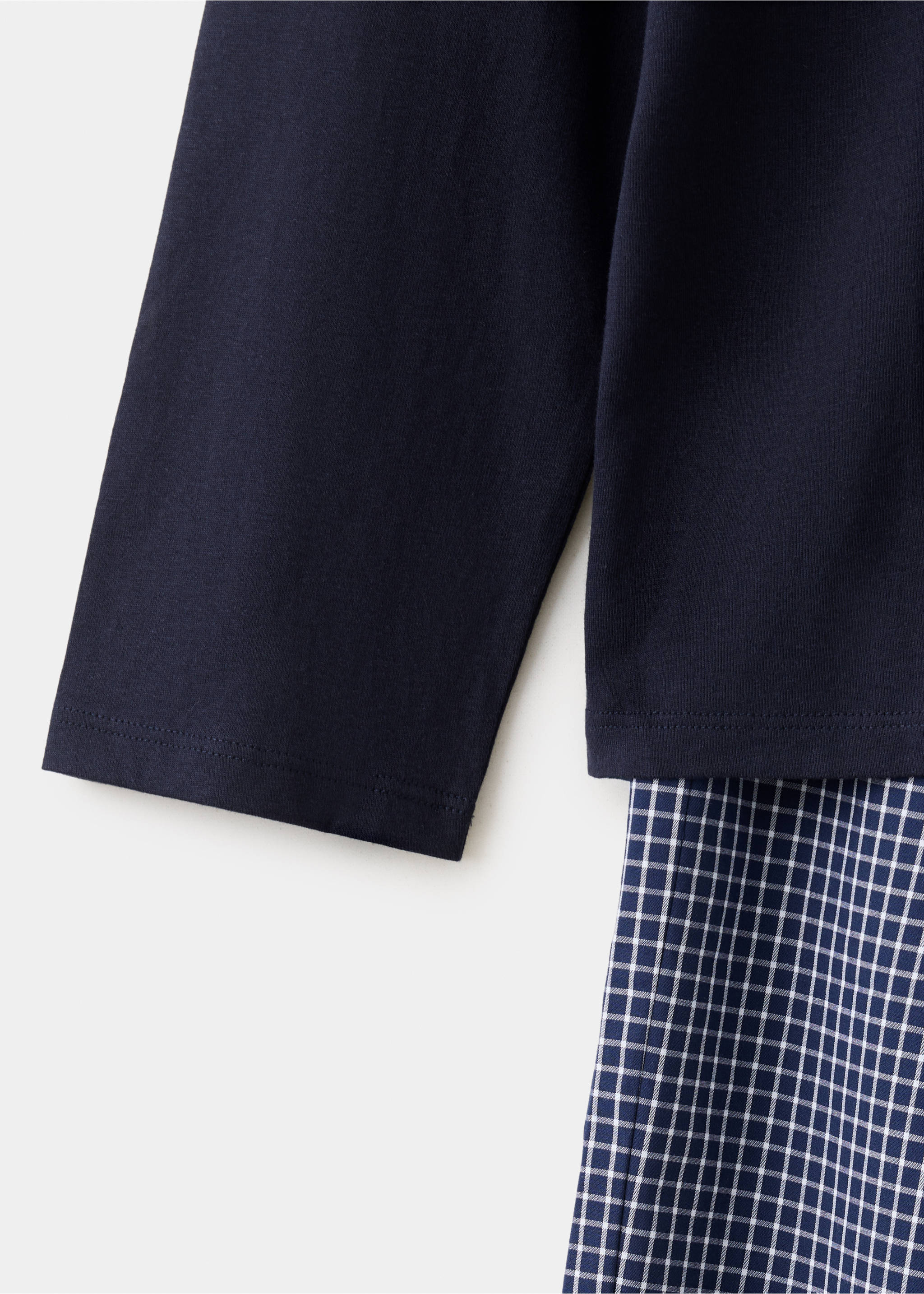 Navy blue pyjama set featuring a plain long-sleeved top and a checked bottom., Navy. Ref: 37065855-00.