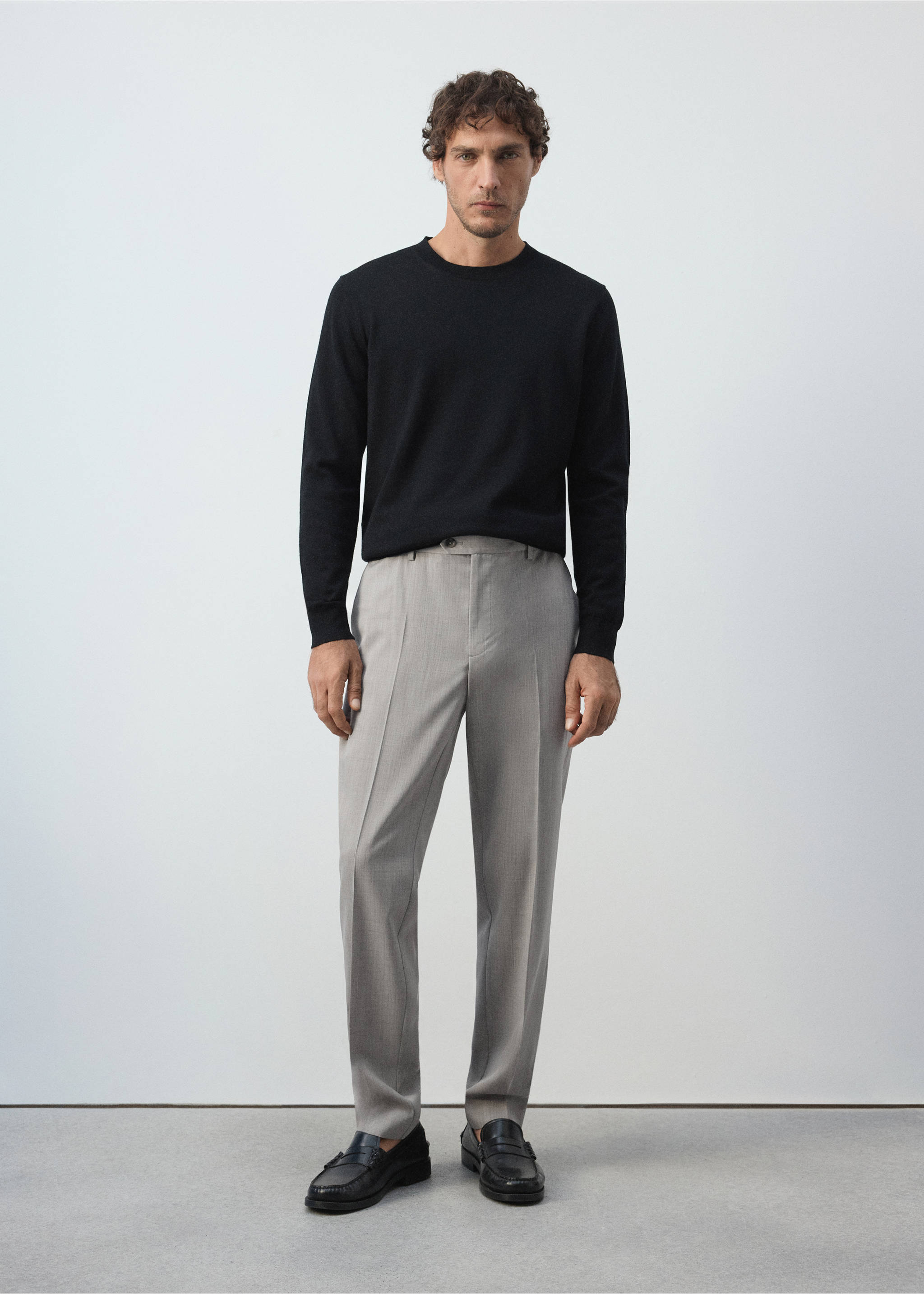 Light grey trousers with pressed creases, styled with a black sweater., Light/Pastel Grey. Ref: 37065975-02.