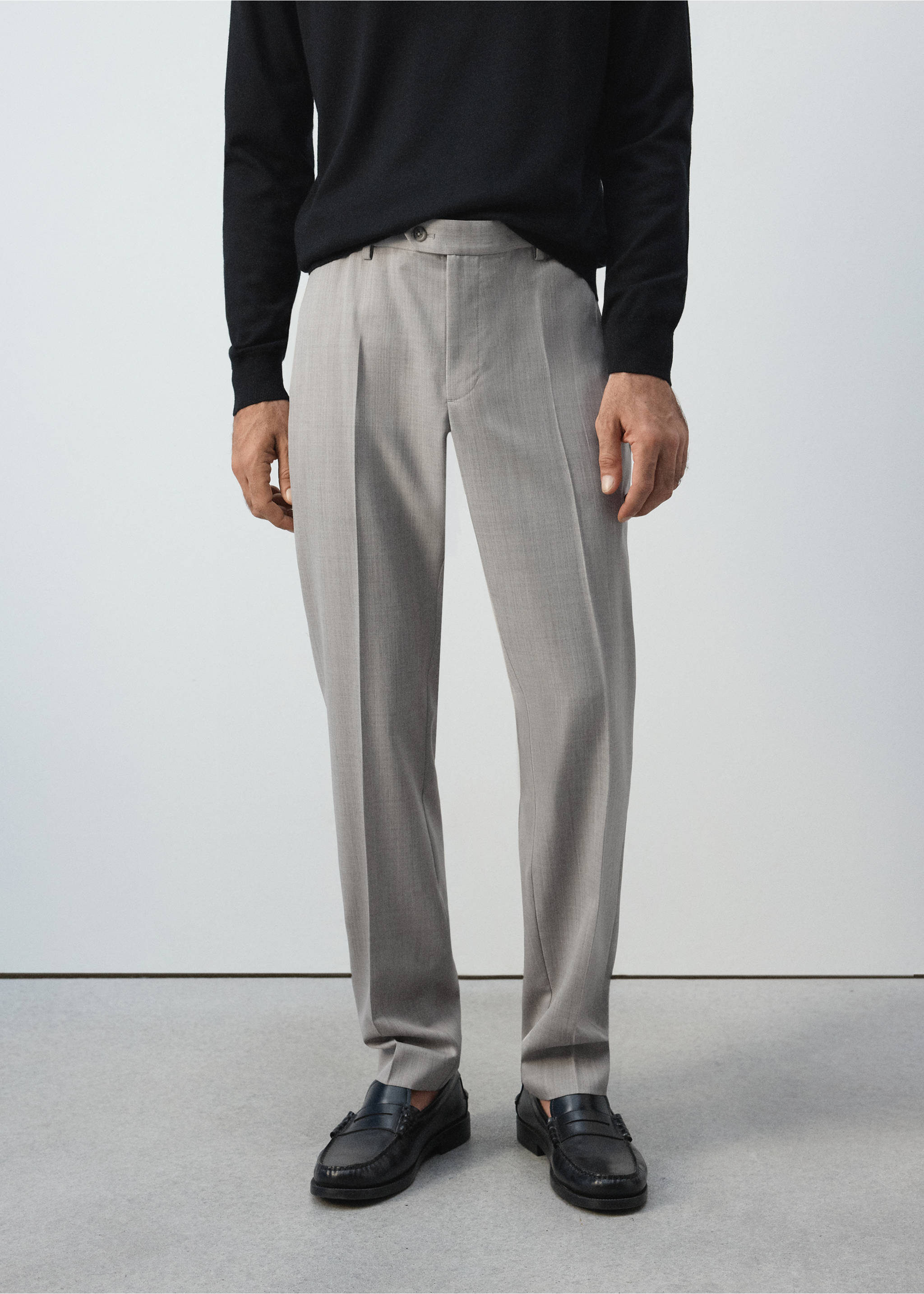 Light grey tailored trousers with front creases, worn with a black sweater., Light/Pastel Grey. Ref: 37065975-02.