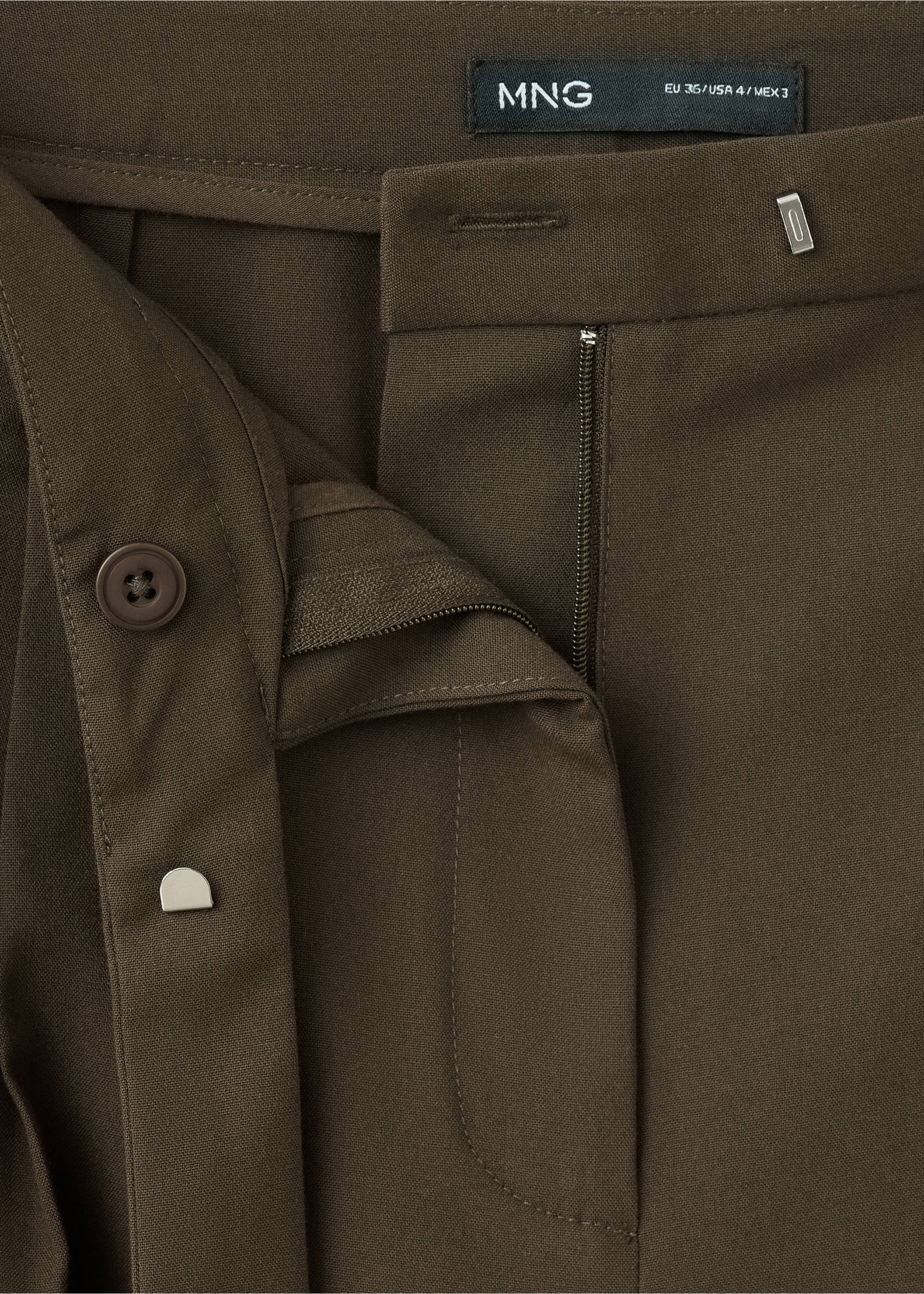 Close-up of olive green trousers waistband and fly detail., Brown. Ref: 37065994-00.