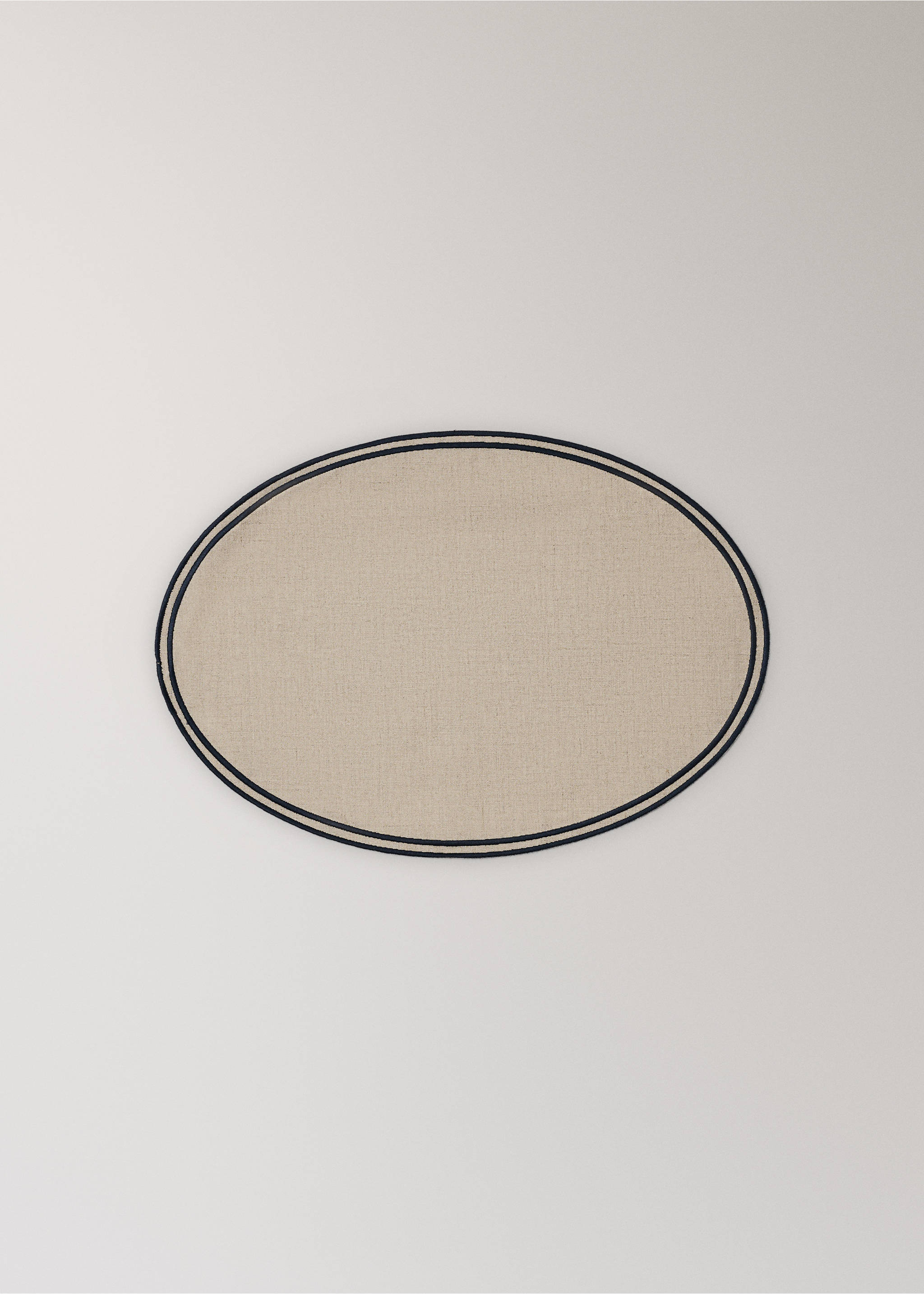 Beige oval placemat with a double navy blue border., Light/Pastel Brown. Ref: 37066330-00.