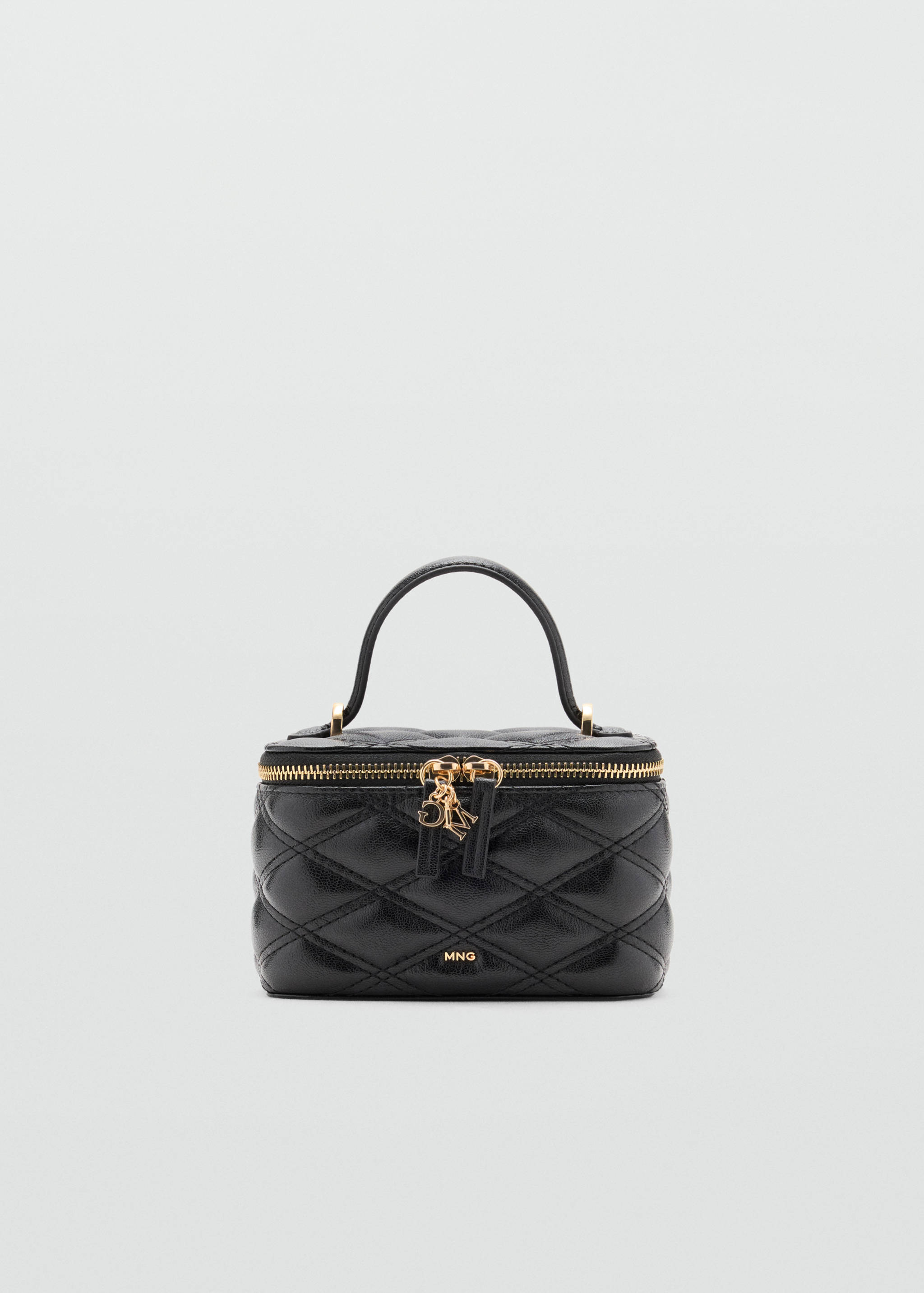 Black quilted vanity case with a top handle and gold-tone zip closure.
