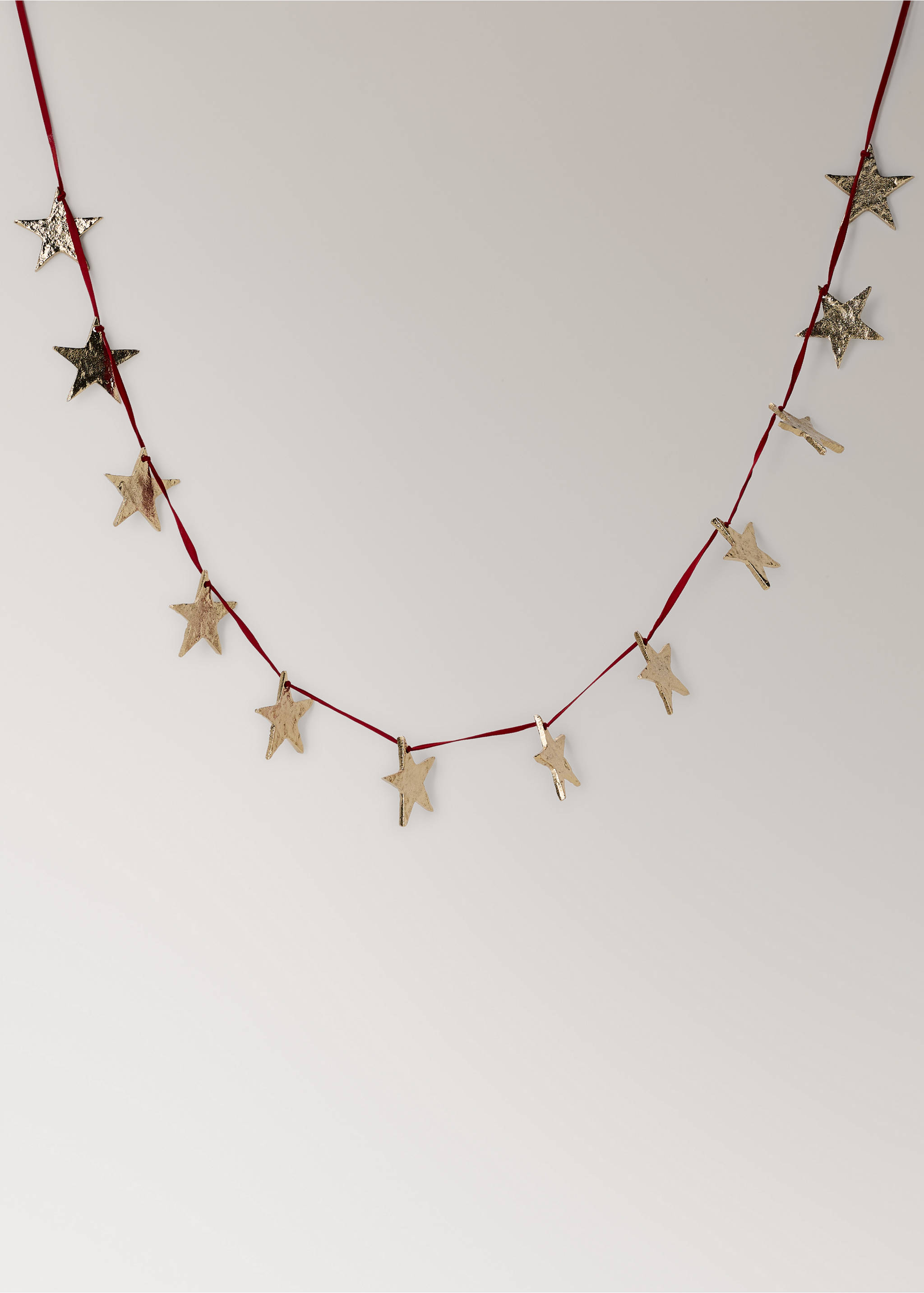Decorative red ribbon garland strung with textured gold-coloured star ornaments., Gold. Ref: 37066728-00.