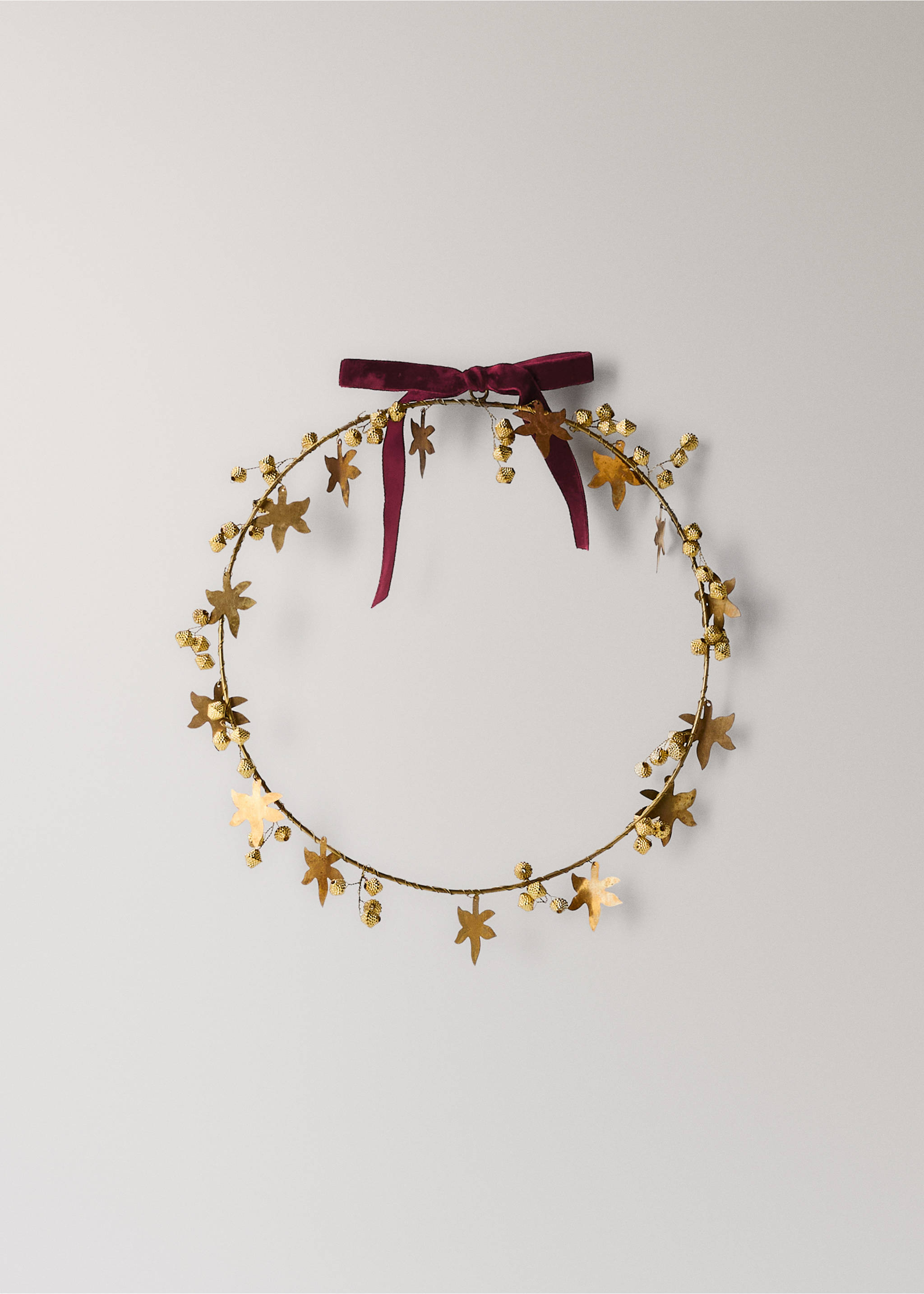 Gold-toned metal decorative wreath adorned with leaves and berries, featuring a burgundy velvet bow., Gold. Ref: 37066735-00.