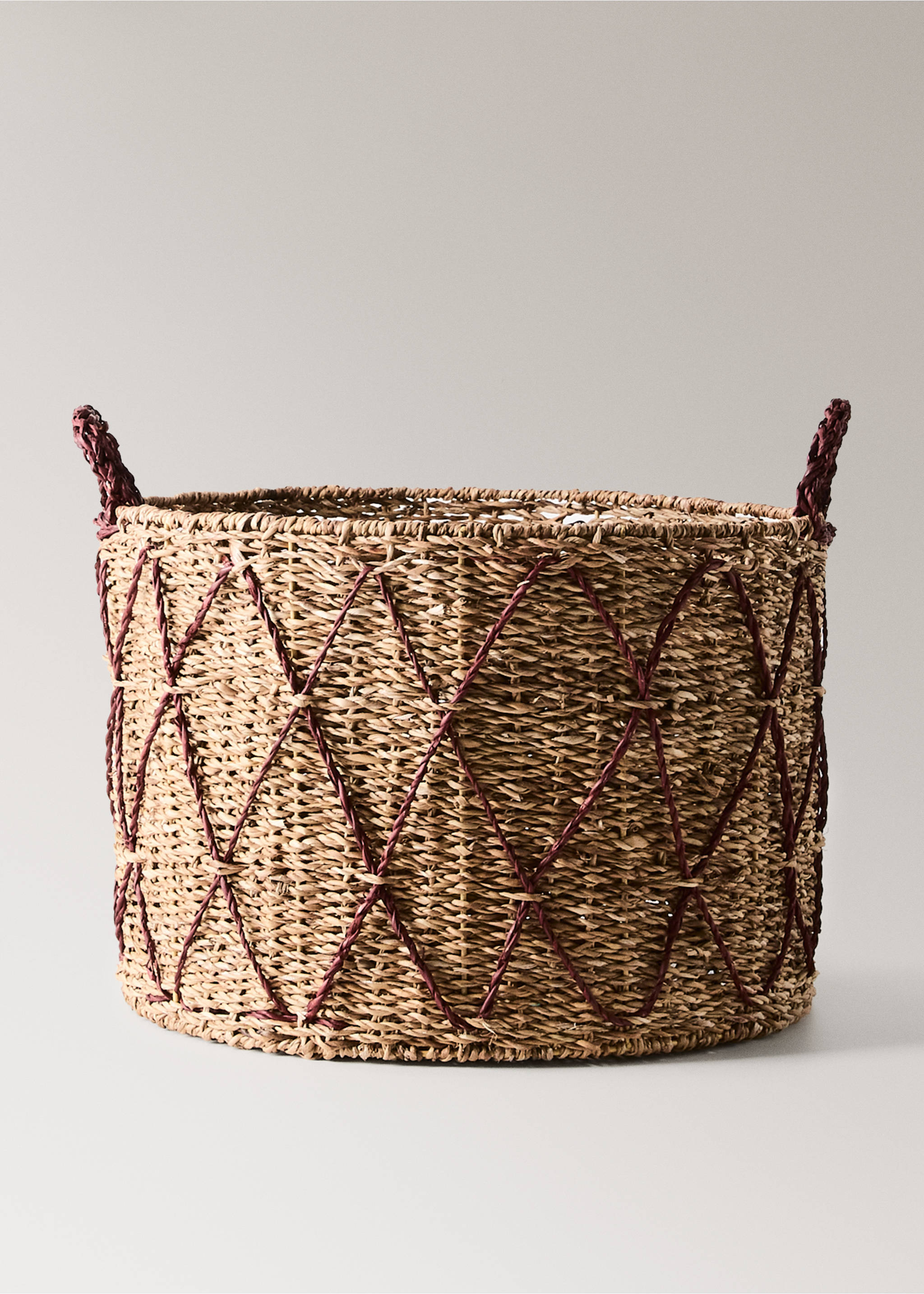 Woven straw storage basket with a dark red diamond pattern and matching handles., Brown. Ref: 37066736-00.