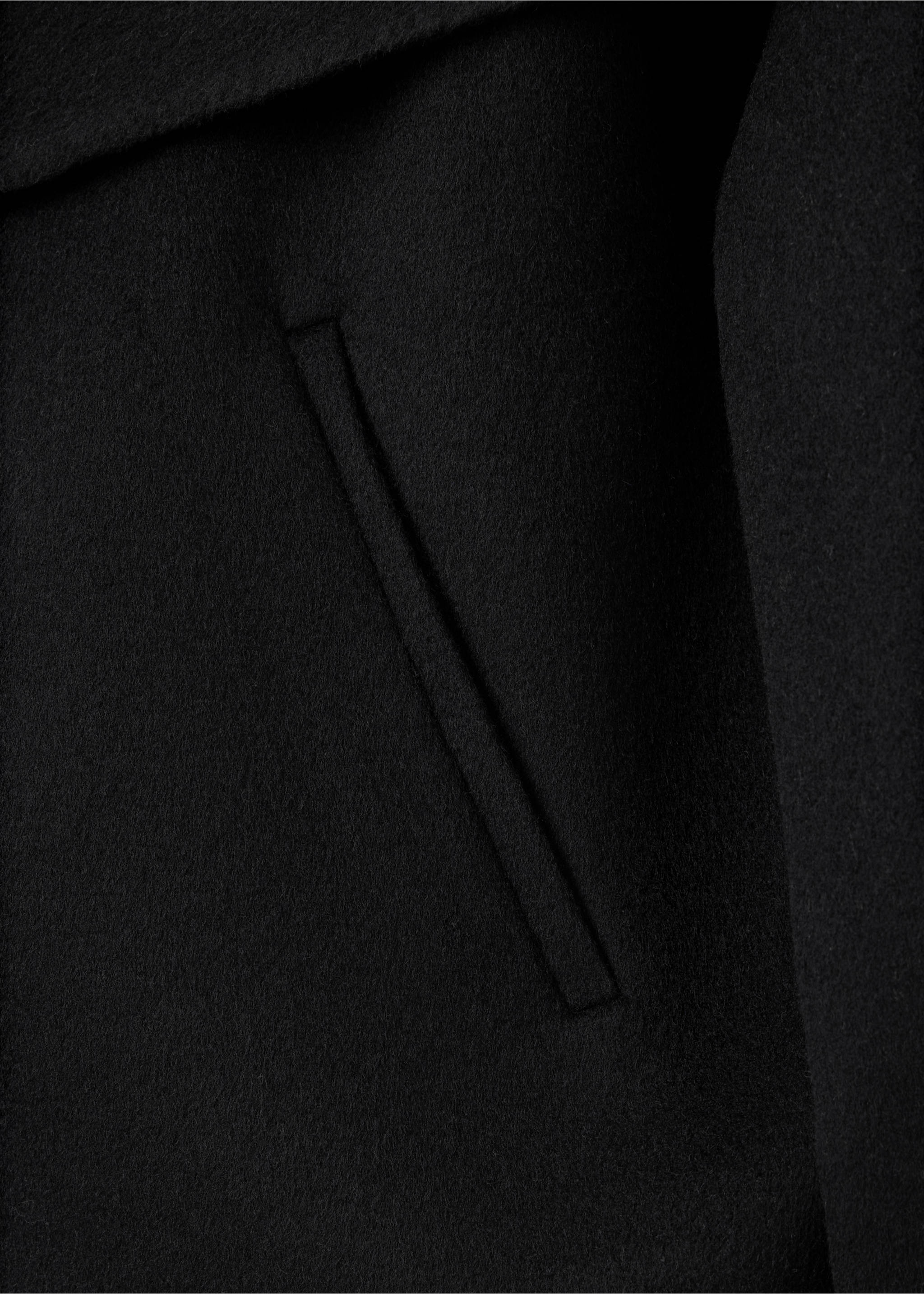 Close-up of the fabric and pocket detail of a black jacket., Black. Ref: 37066740-00.