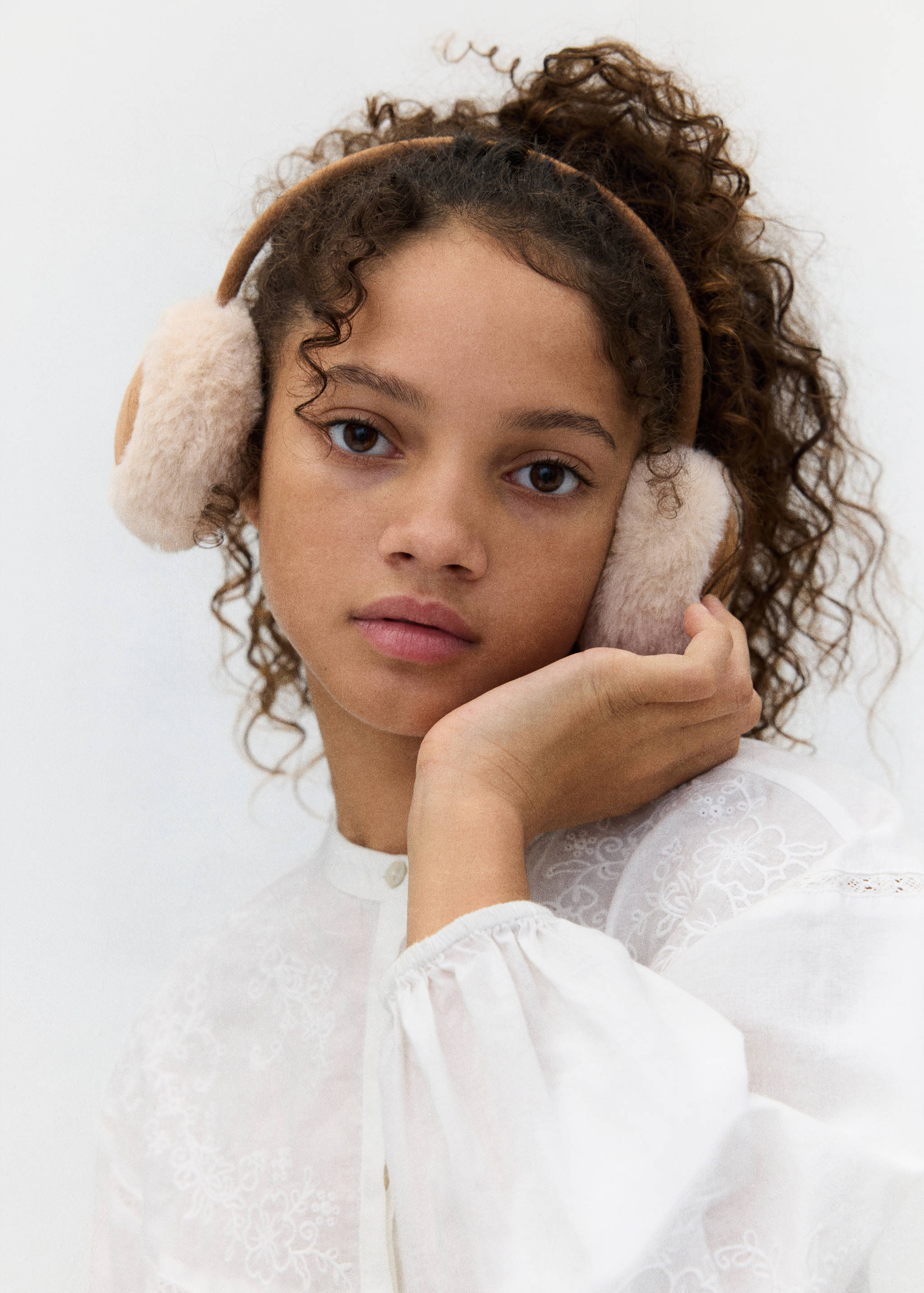 Brown and cream faux-fur earmuffs.