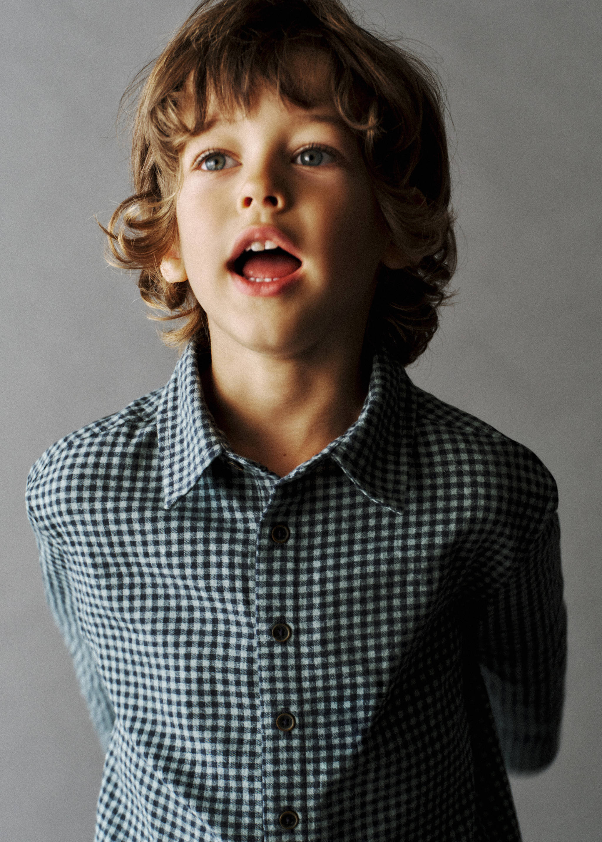 Black and blue gingham check shirt with a classic collar.