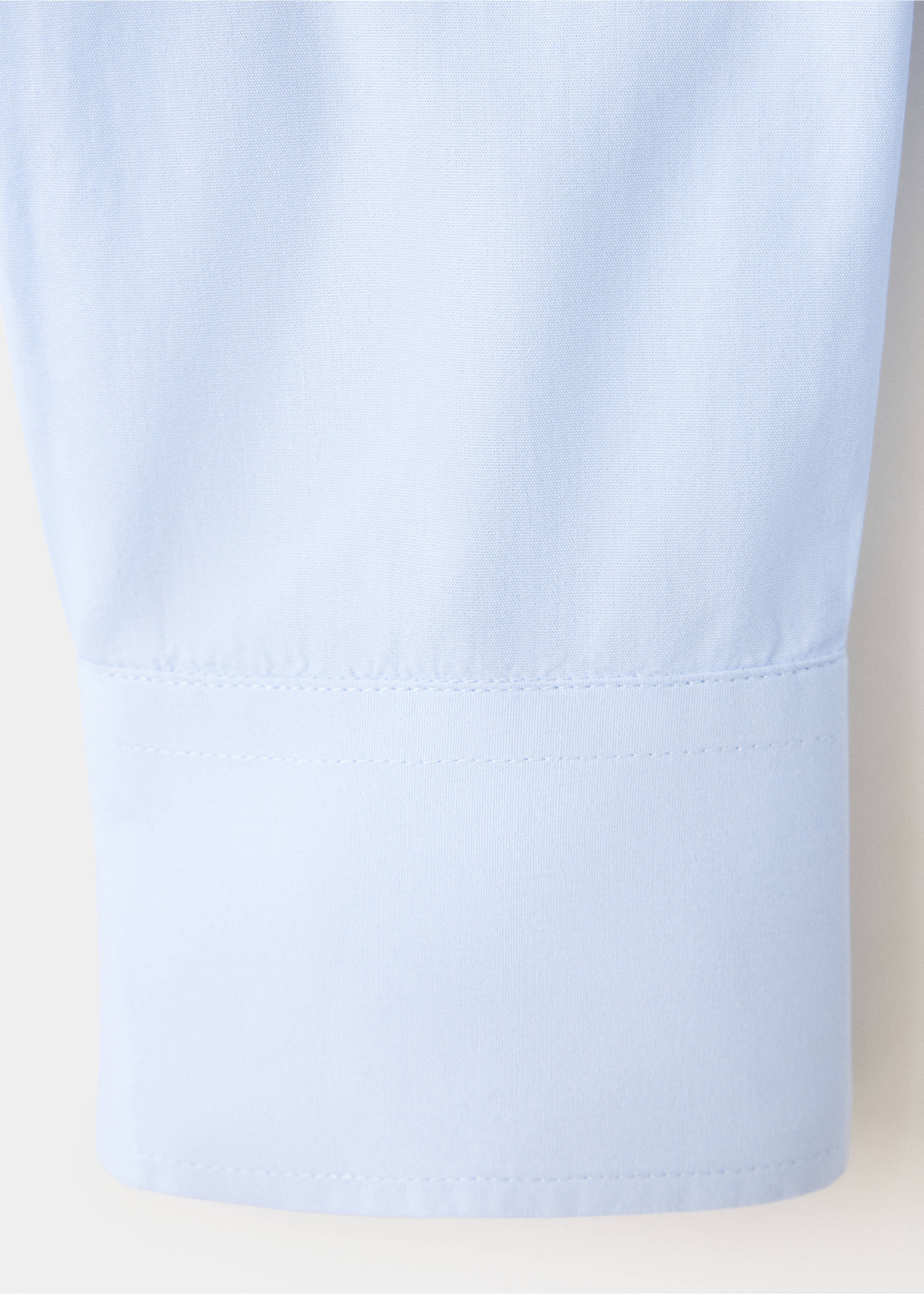 Close-up of fabric and cuff detail on a light blue shirt., Sky Blue. Ref: 37067134-00.