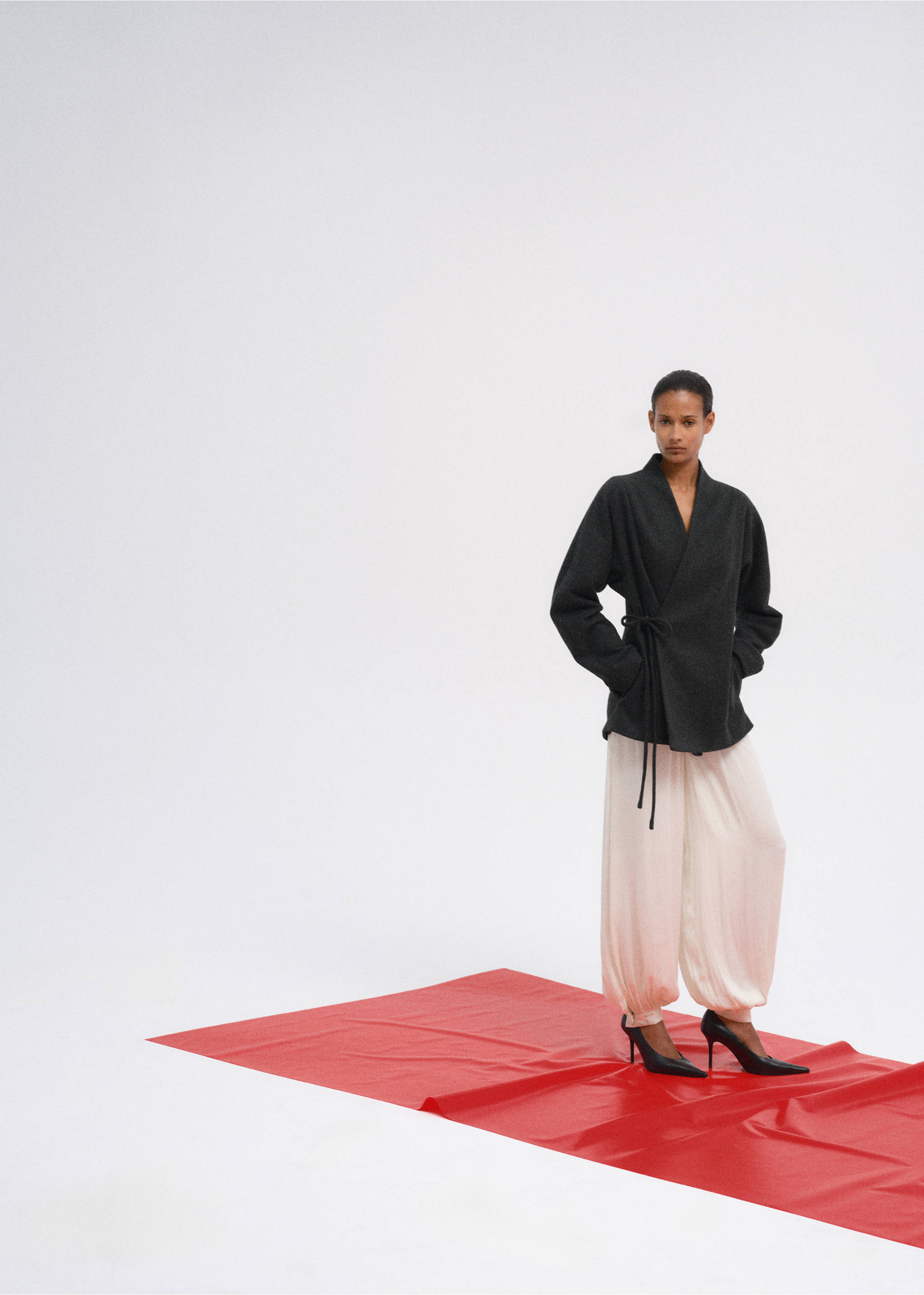 Dark grey wrap coat with side tie, styled with light loose trousers., Charcoal. Ref: 37067782-00.