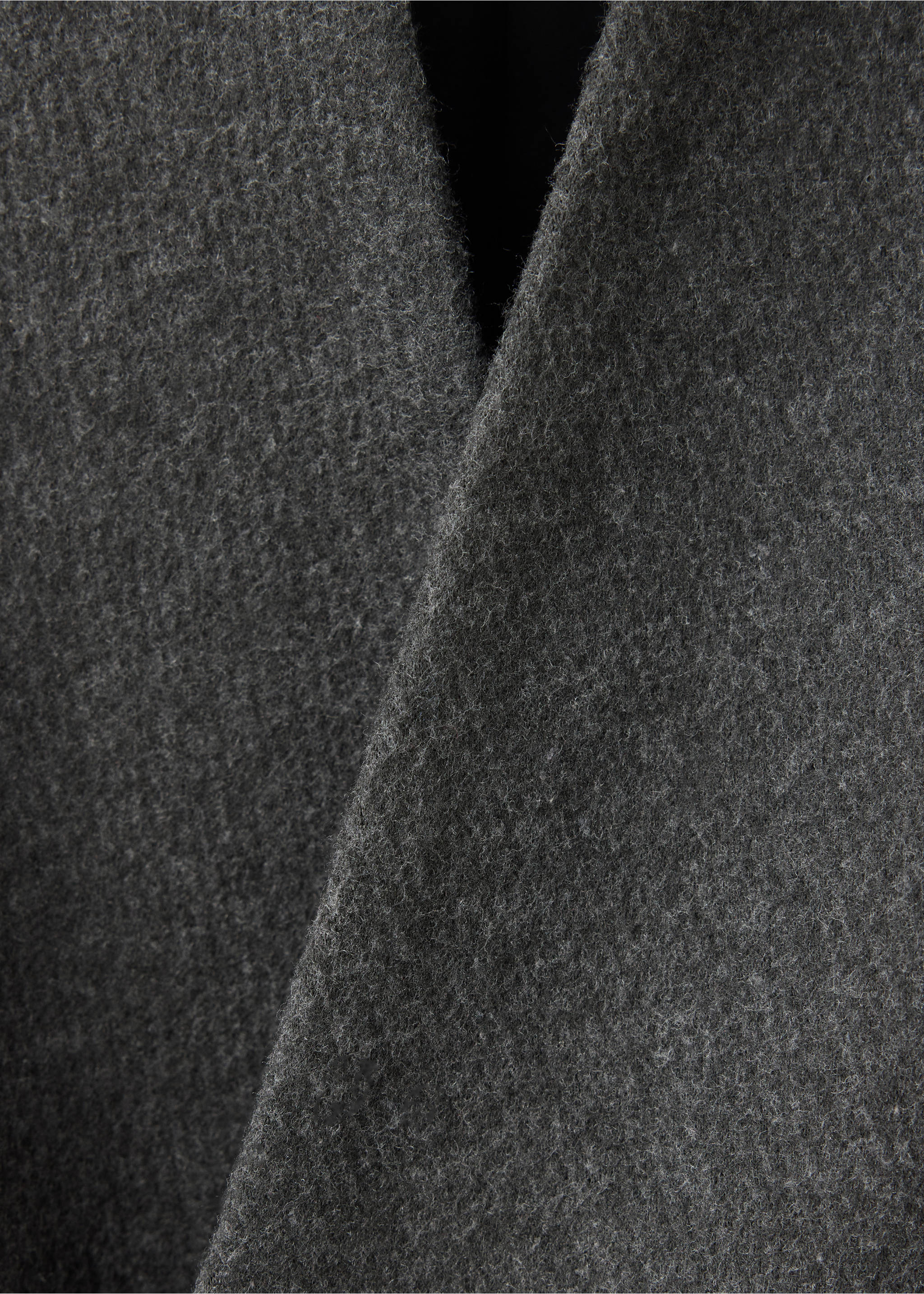 Close-up of the dark grey textured fabric on a coat., Charcoal. Ref: 37067782-00.