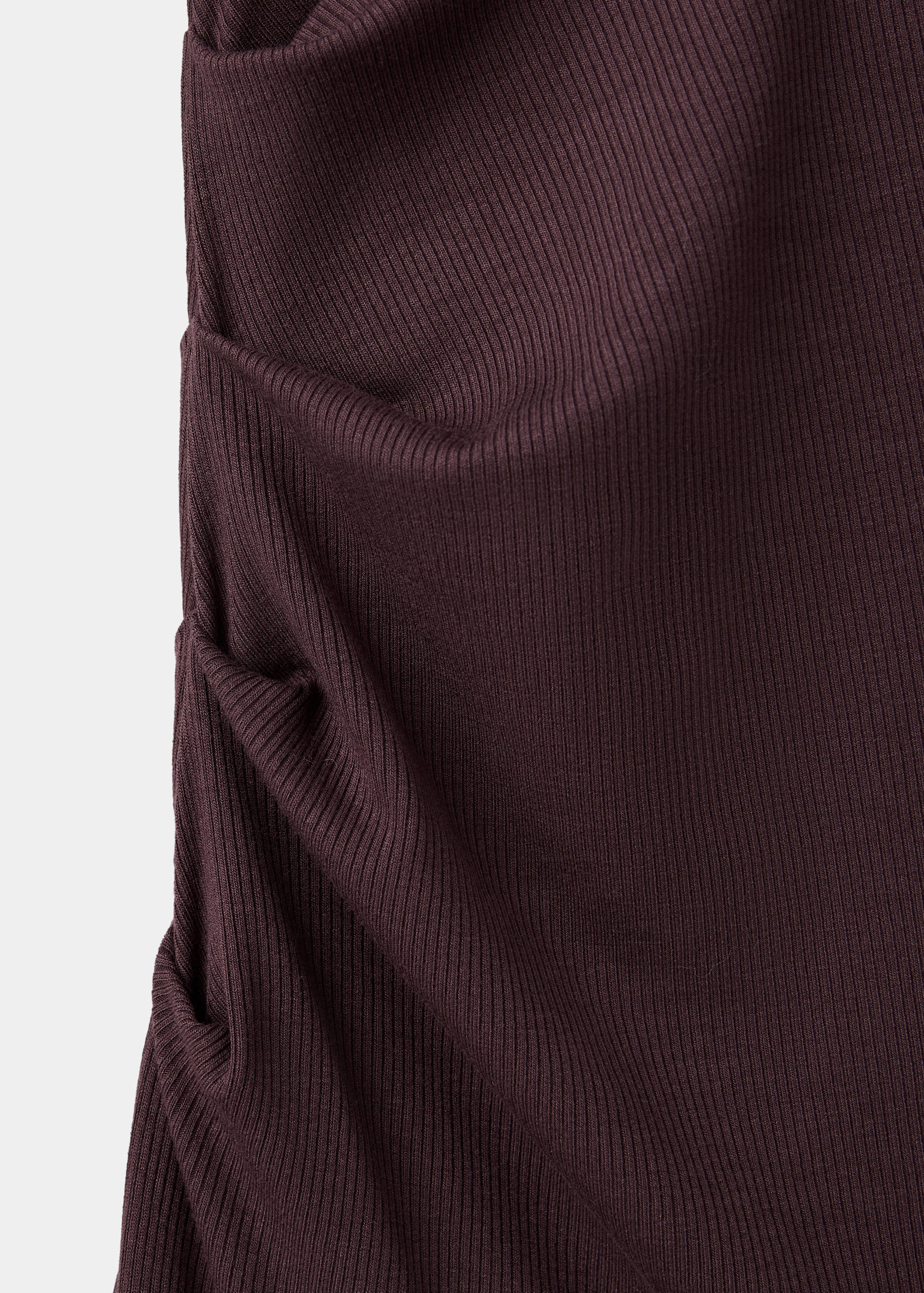 Dark burgundy ribbed dress detail showing side ruching.