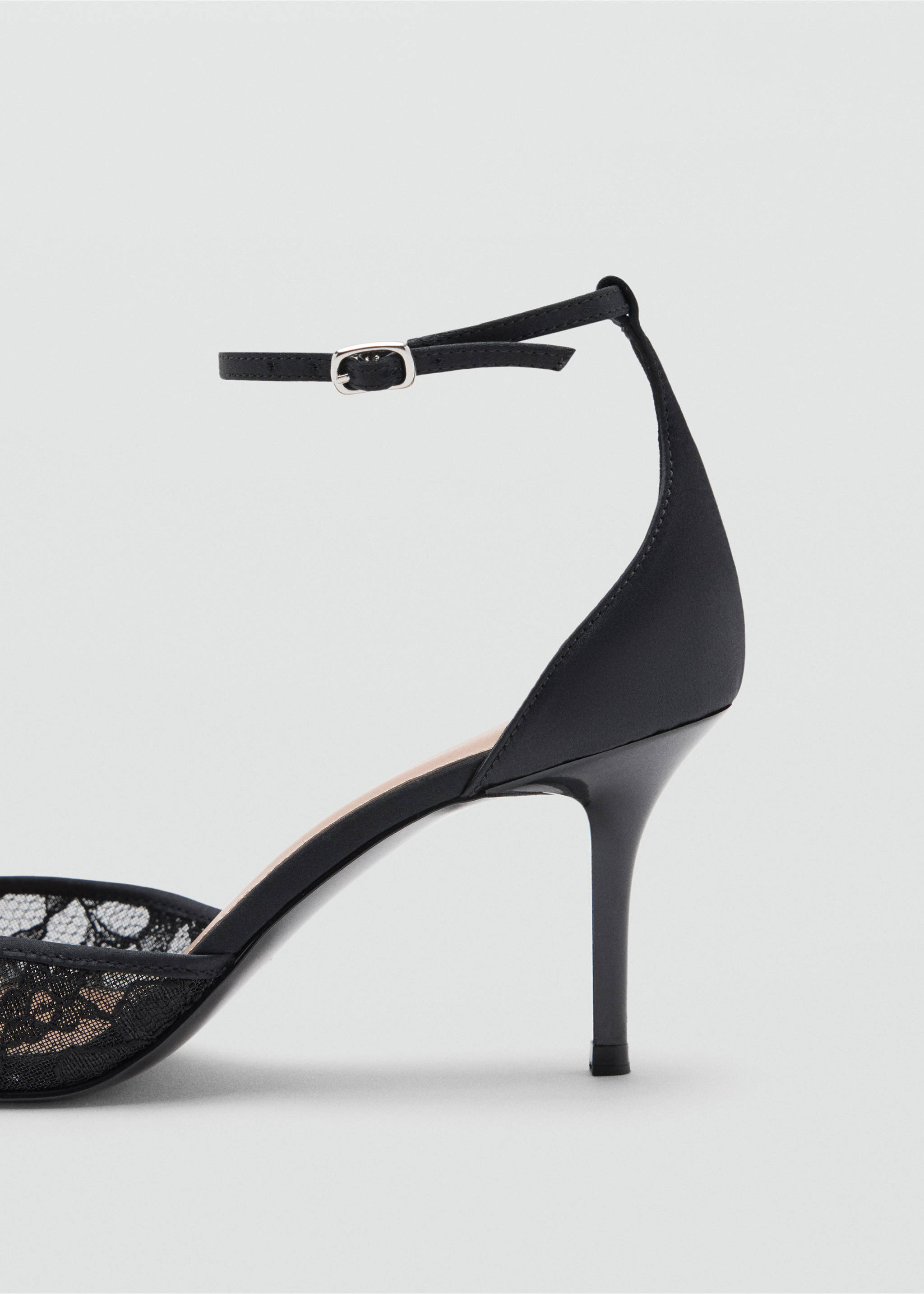 Close-up of a black shoe with a stiletto heel, ankle strap, and lace detail., Black. Ref: 37067788-00.