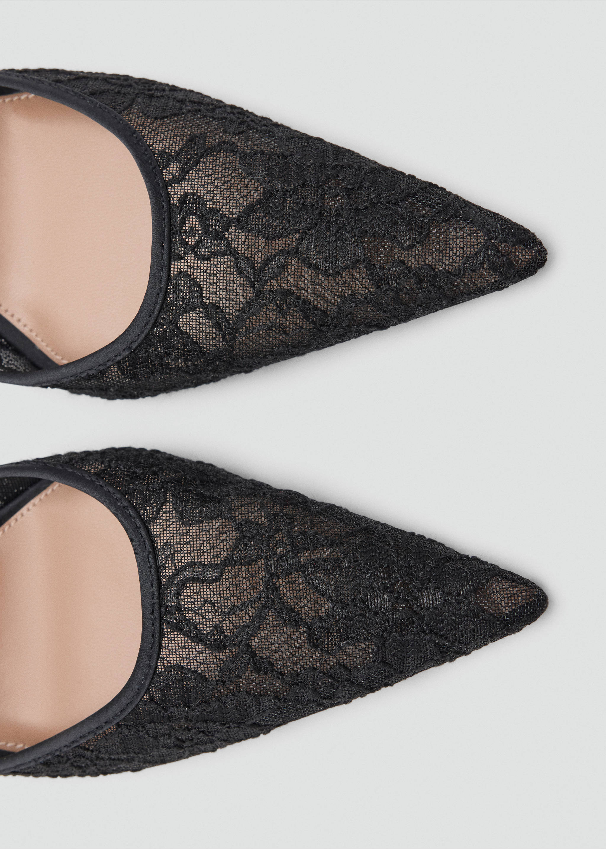 Close-up of black lace pointed-toe shoes., Black. Ref: 37067788-00.