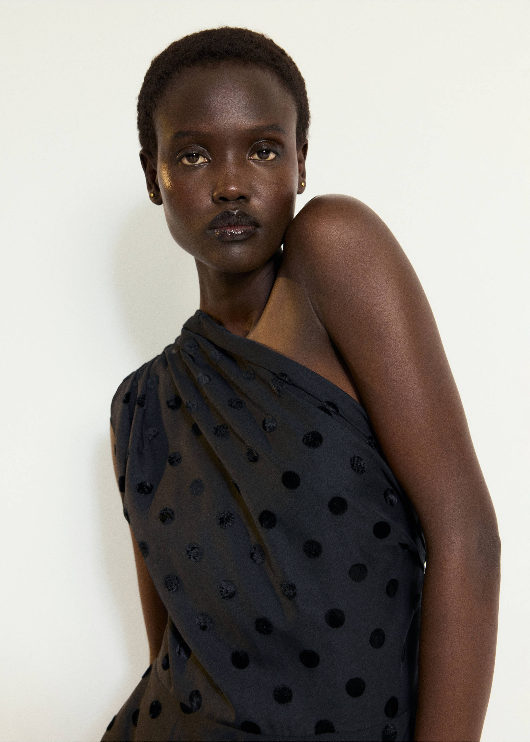 Black one-shoulder top with gathered neckline and sheer polka dot fabric, Black. Ref: 37067793-00.
