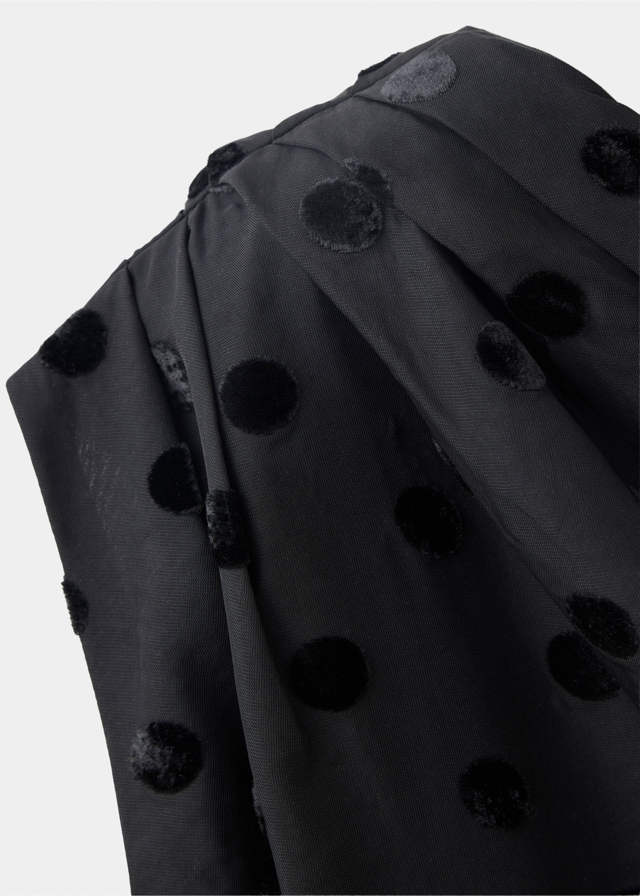 Close-up of a black top with velvet polka dots and pleating., Black. Ref: 37067793-00.
