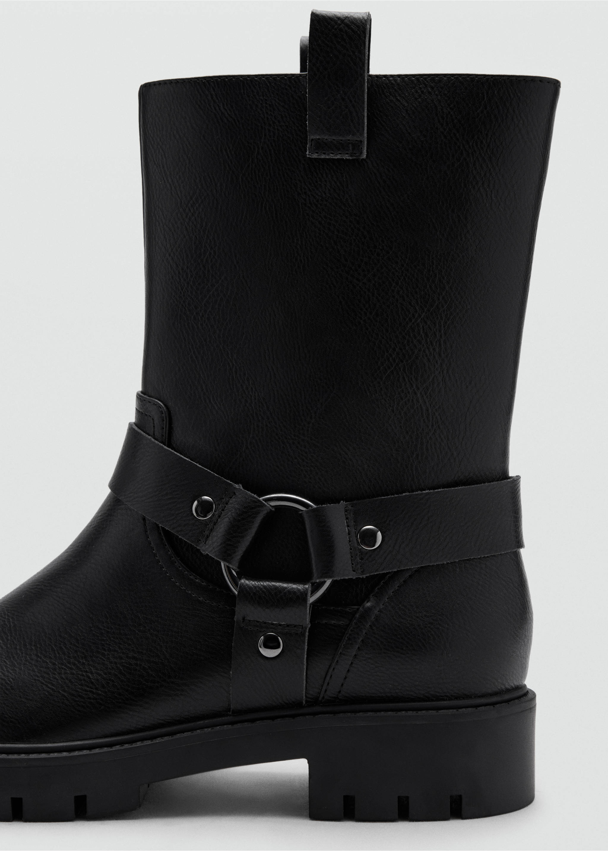 Close-up of a black mid-calf boot with a lug sole and an ankle strap with a metal O-ring., Black. Ref: 37067797-00.