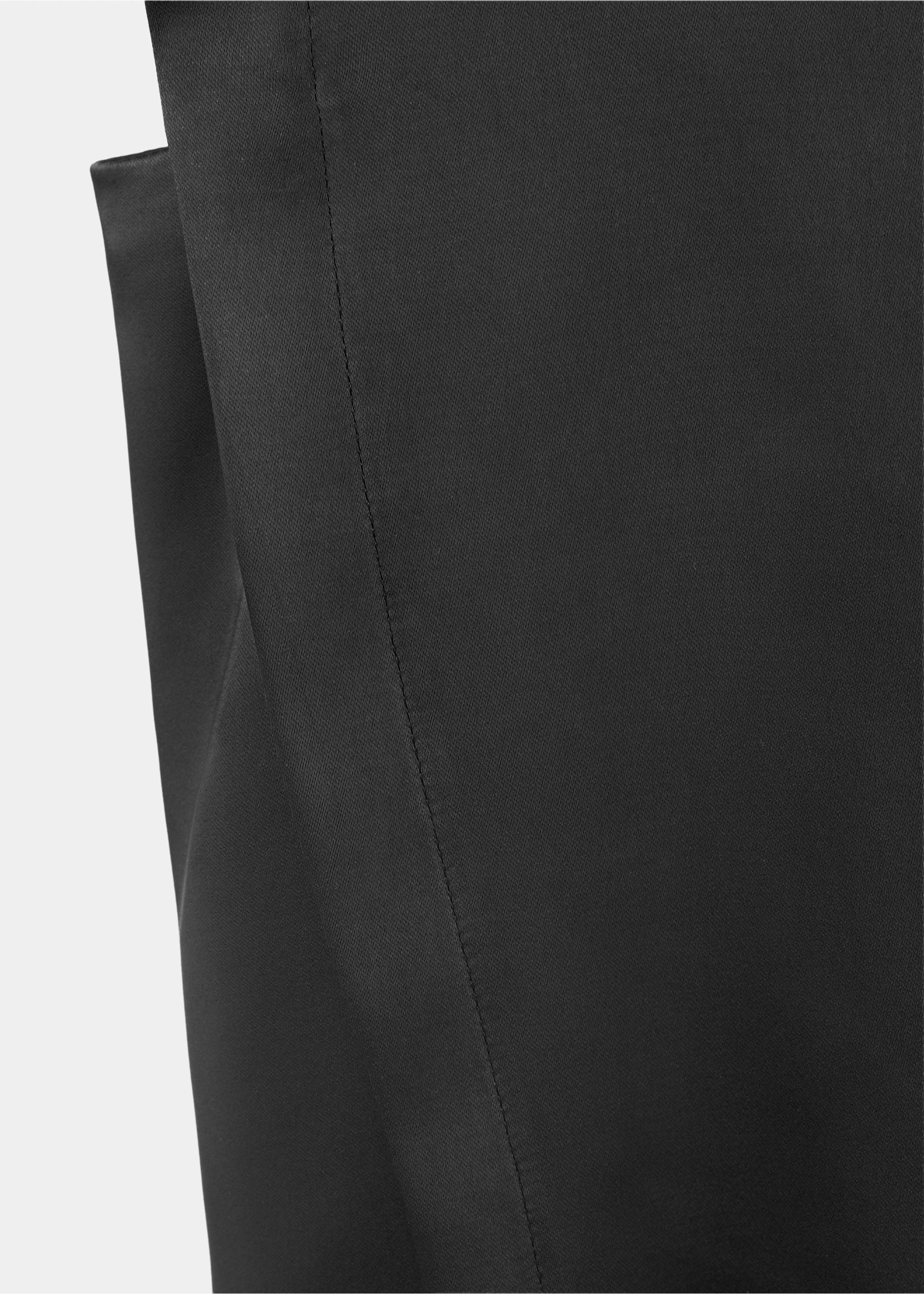 Close-up of the smooth black fabric and stitching on a blouse., Black. Ref: 37067806-00.