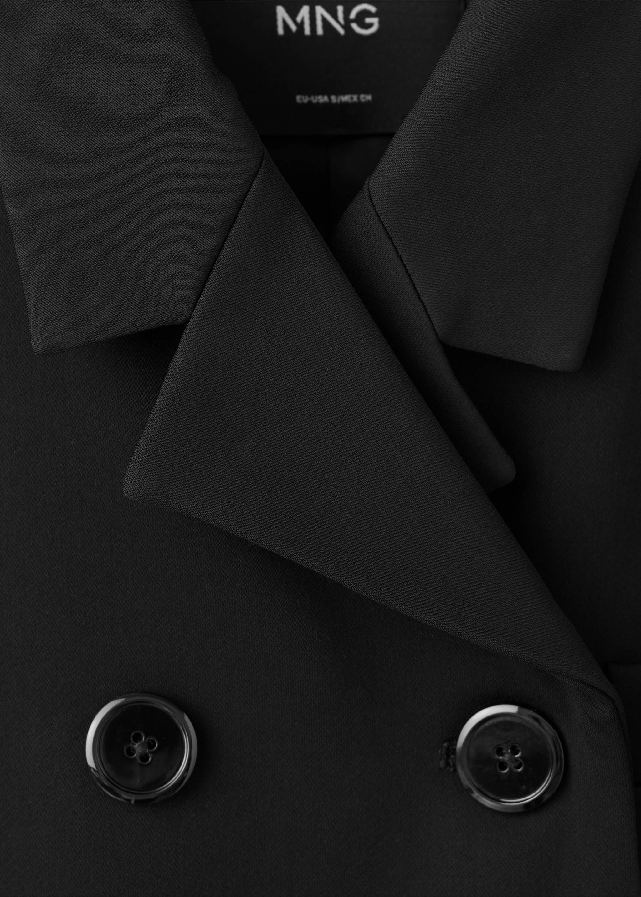 Close-up of a black blazer showing the lapels and double-breasted buttons., Black. Ref: 37067807-00.