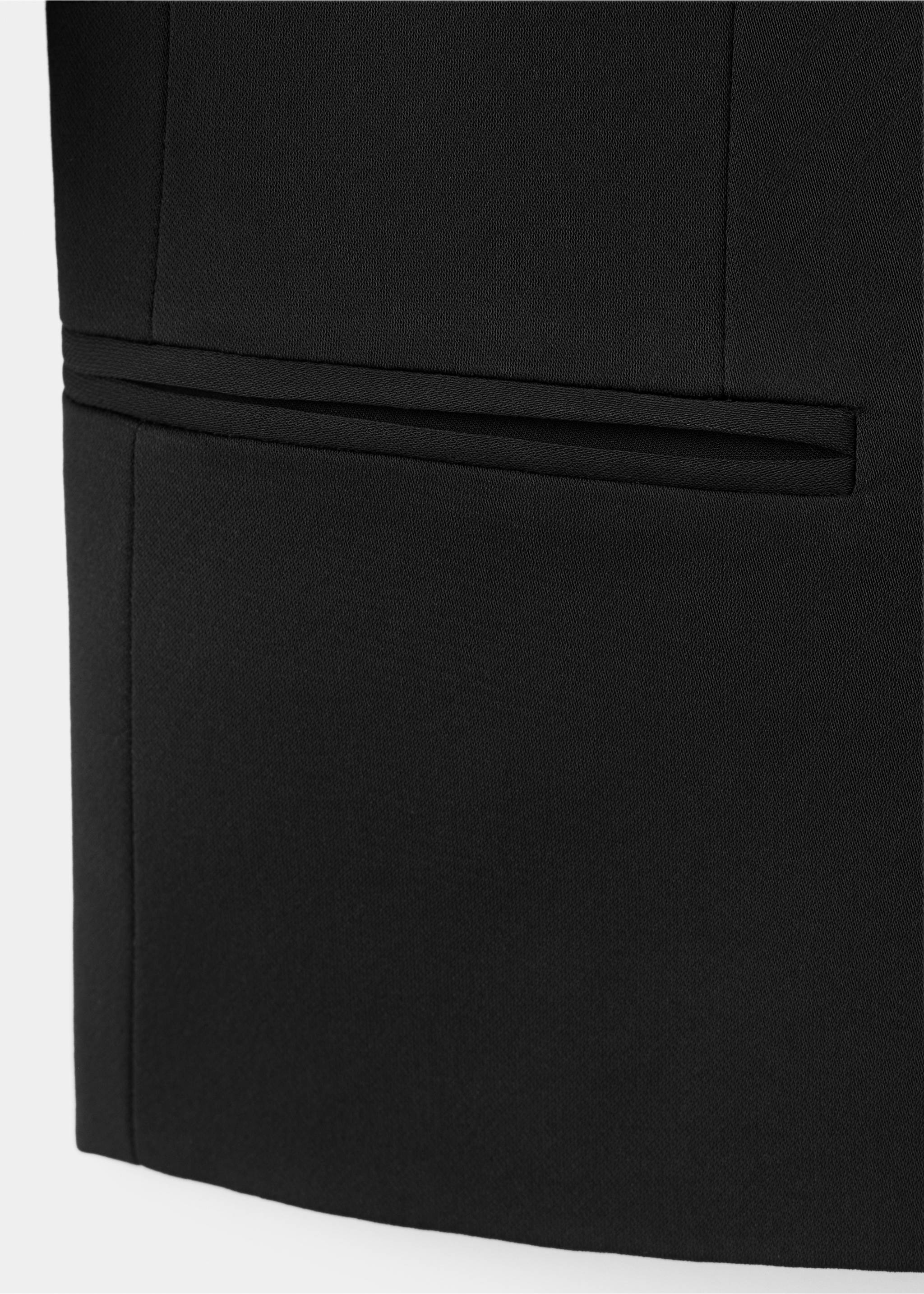 Close-up of black blazer fabric and welt pocket detail, Black. Ref: 37067807-00.