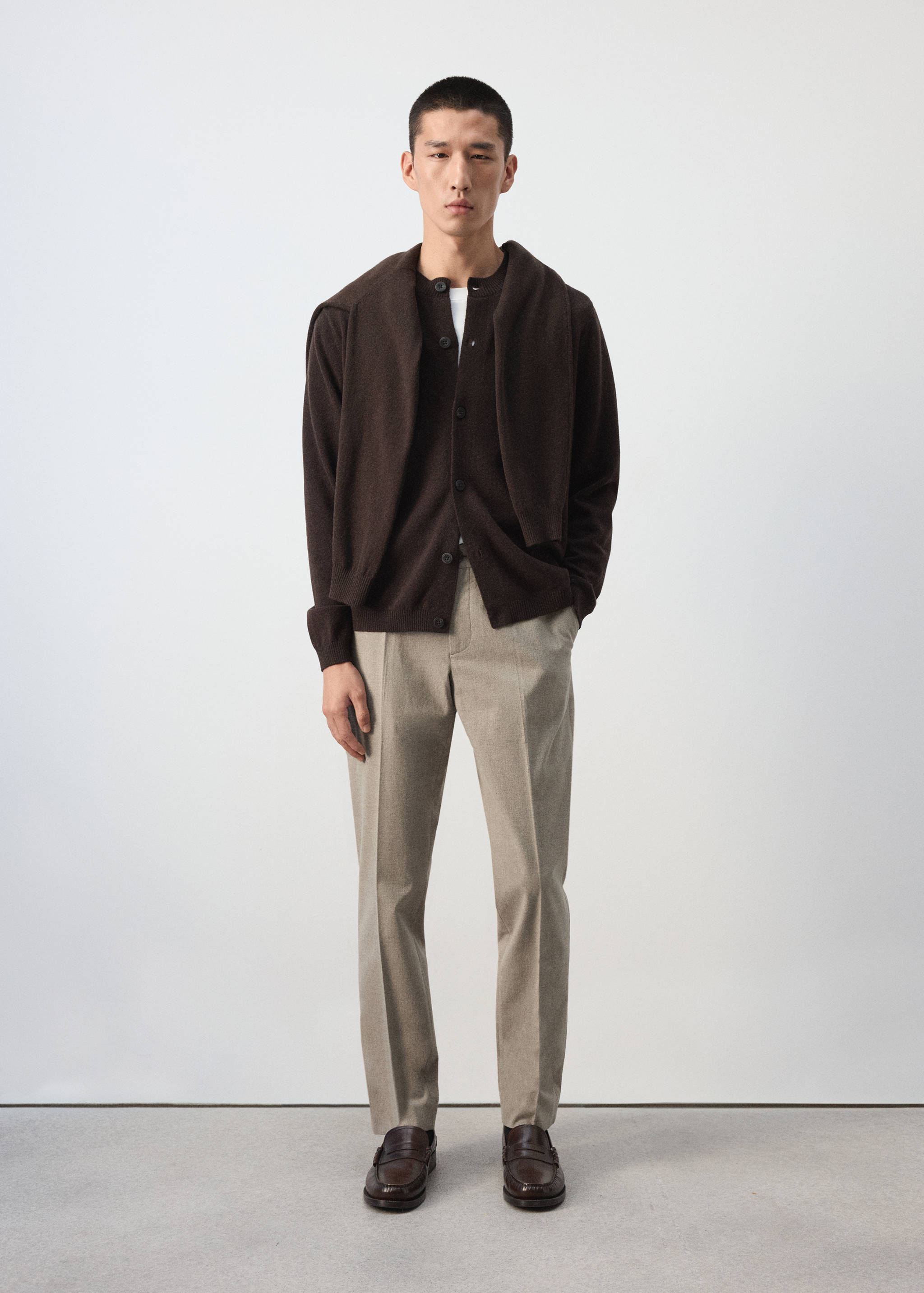 Dark brown knit cardigan with button-up front and crew neckline.