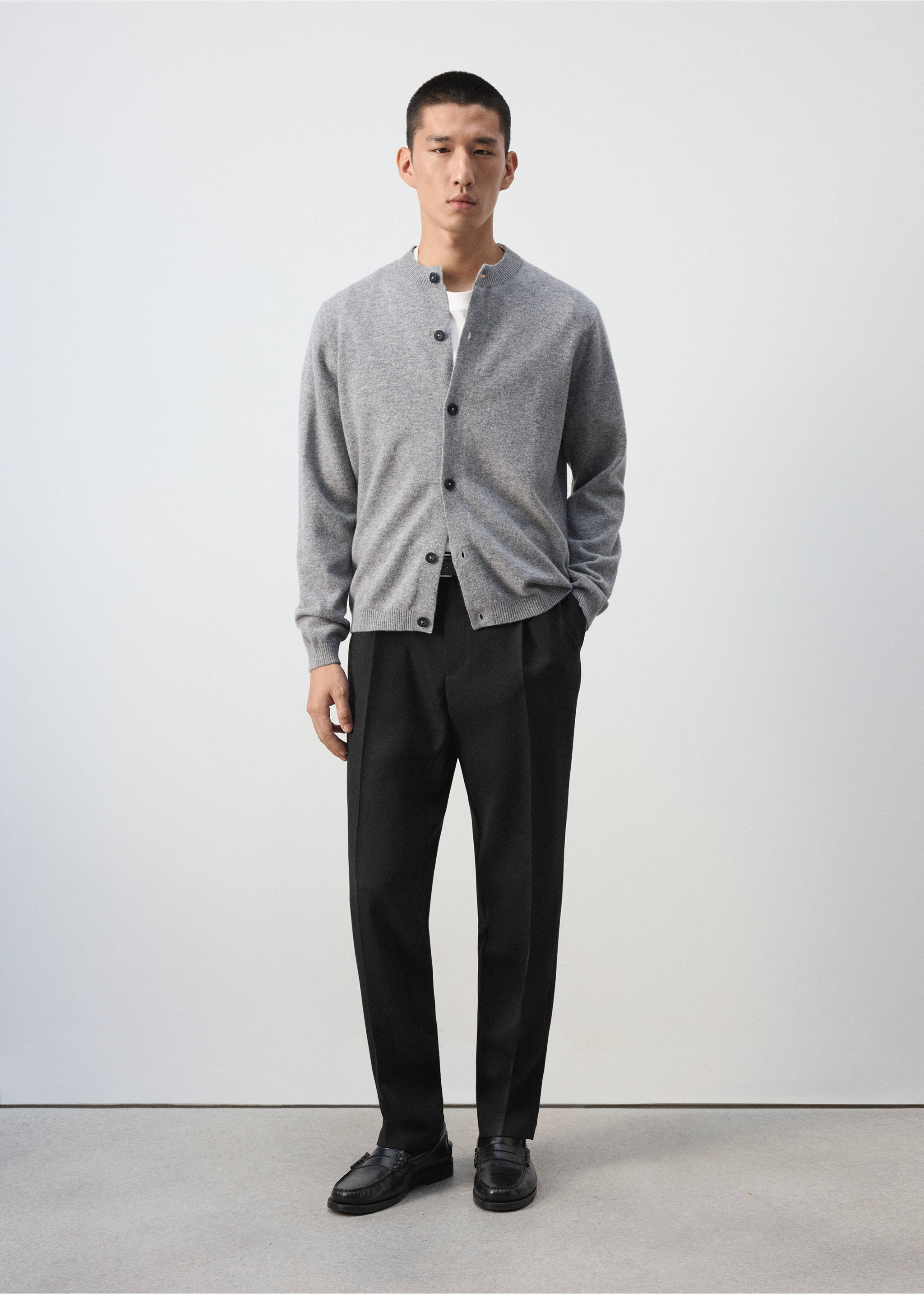 Grey knit cardigan with a round collar, worn with black trousers and black loafers., Medium Heather Grey. Ref: 37067886-00.