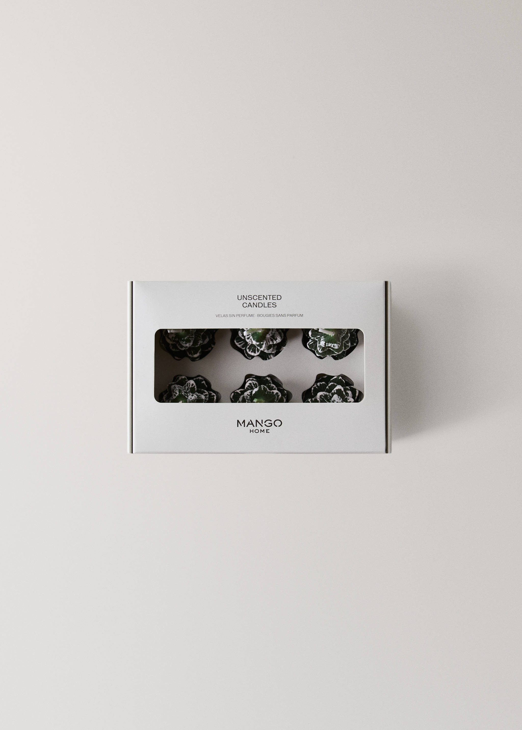 A box of six green, flower-shaped unscented candles.