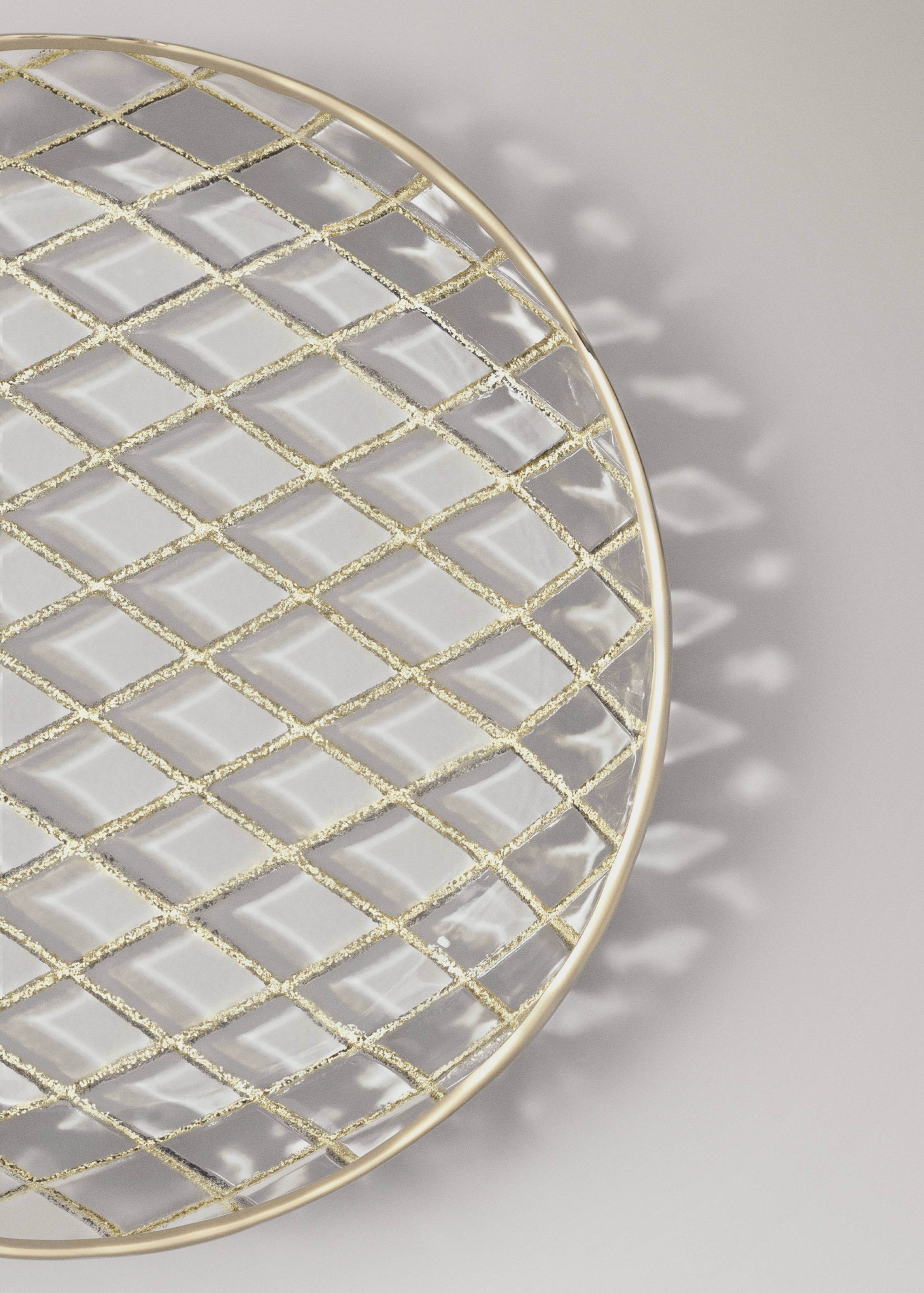 Glass plate with gold glitter diamond pattern and gold-toned rim.