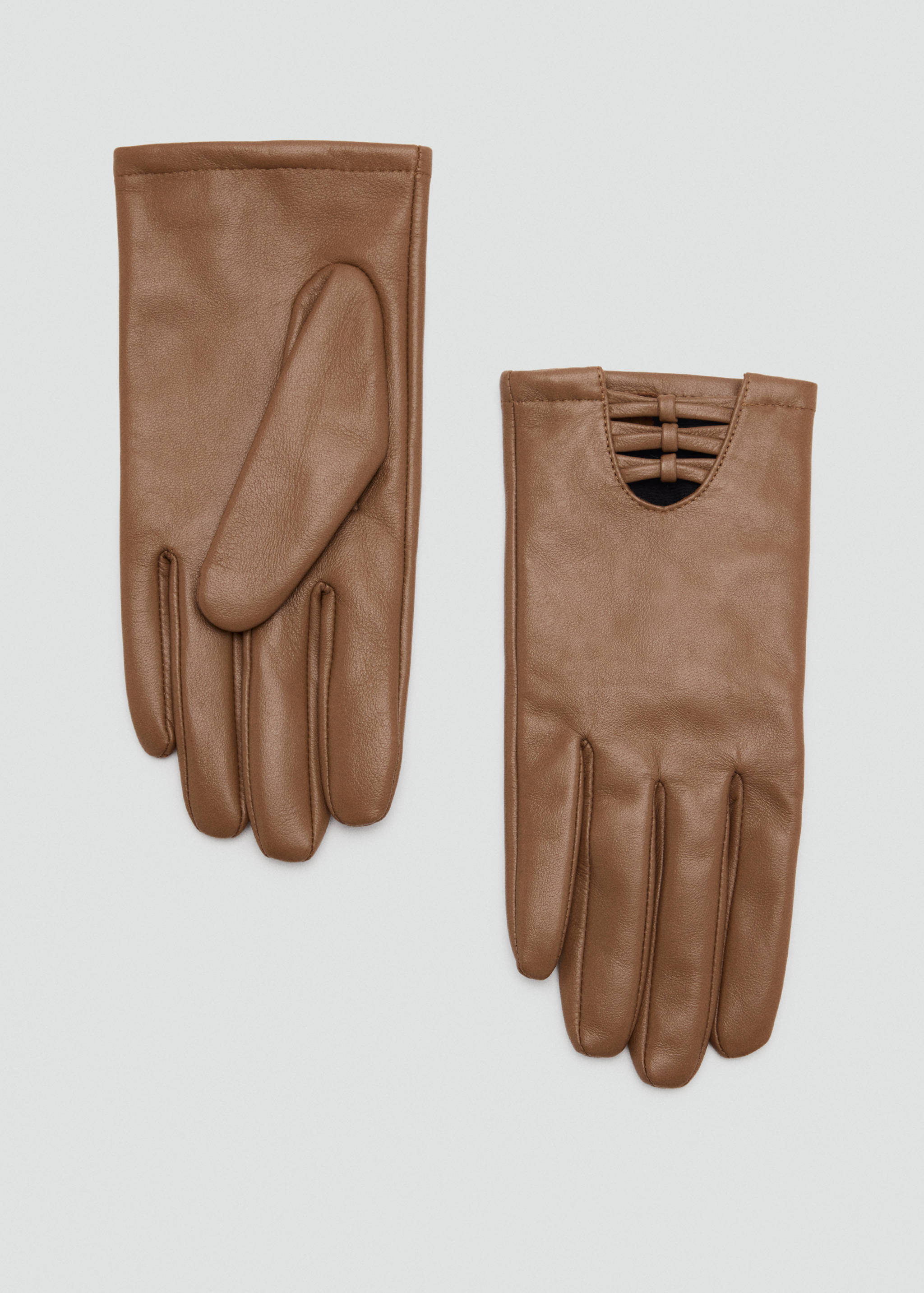 Medium brown leather gloves with a cutout and strap detail on the back.