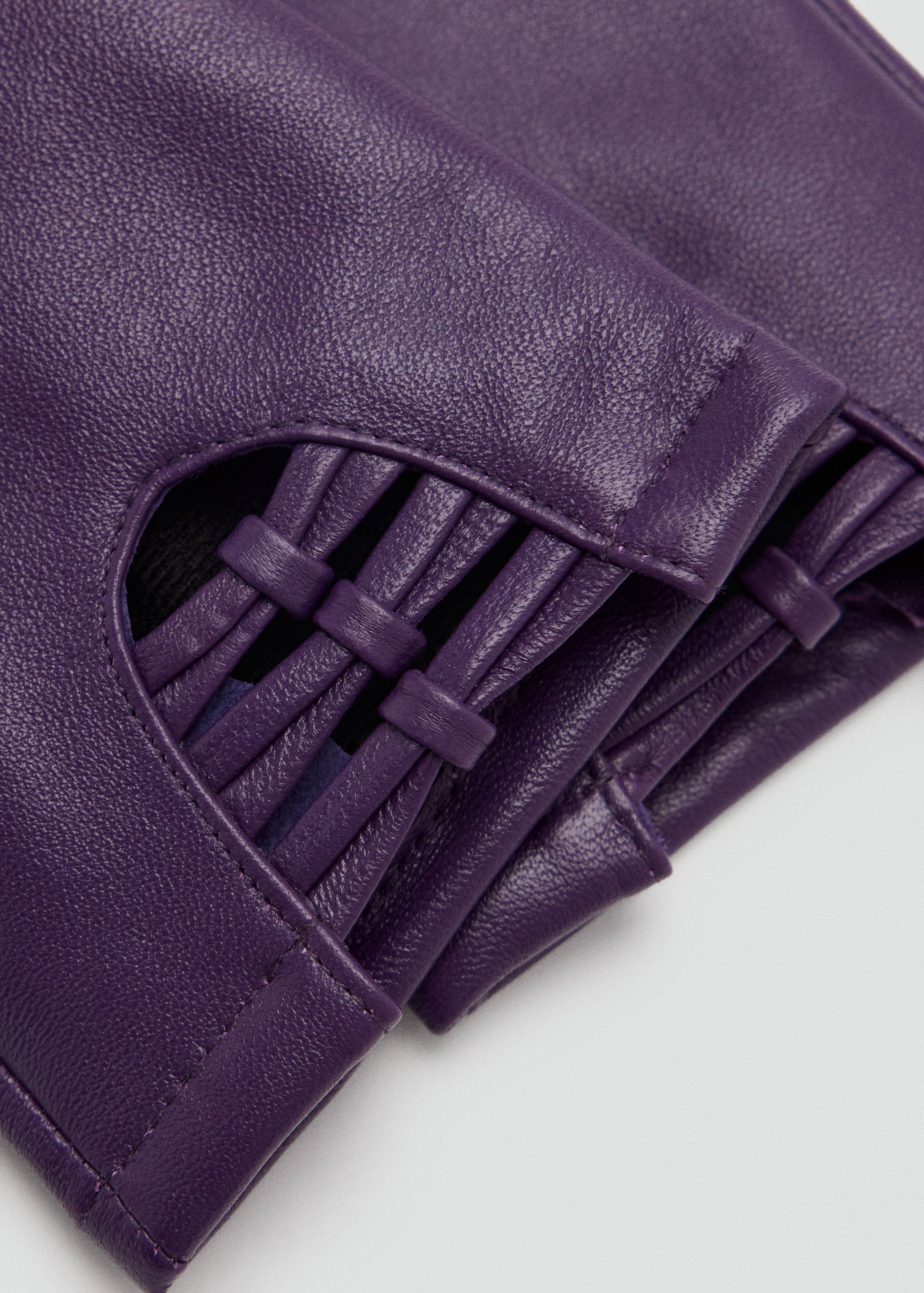 Purple leather gloves with a woven cutout wrist detail.