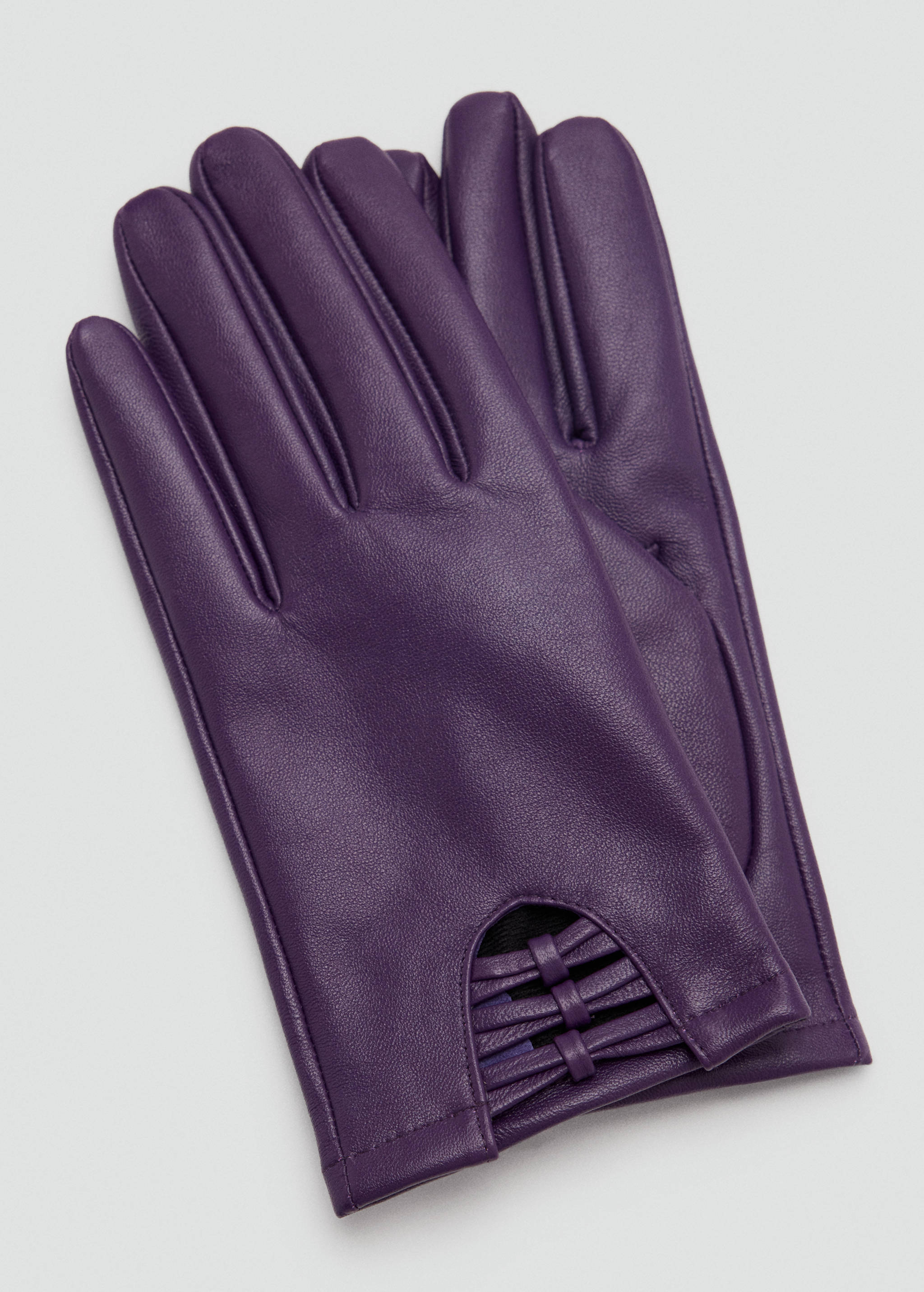 Purple leather gloves with a laced wrist cutout.