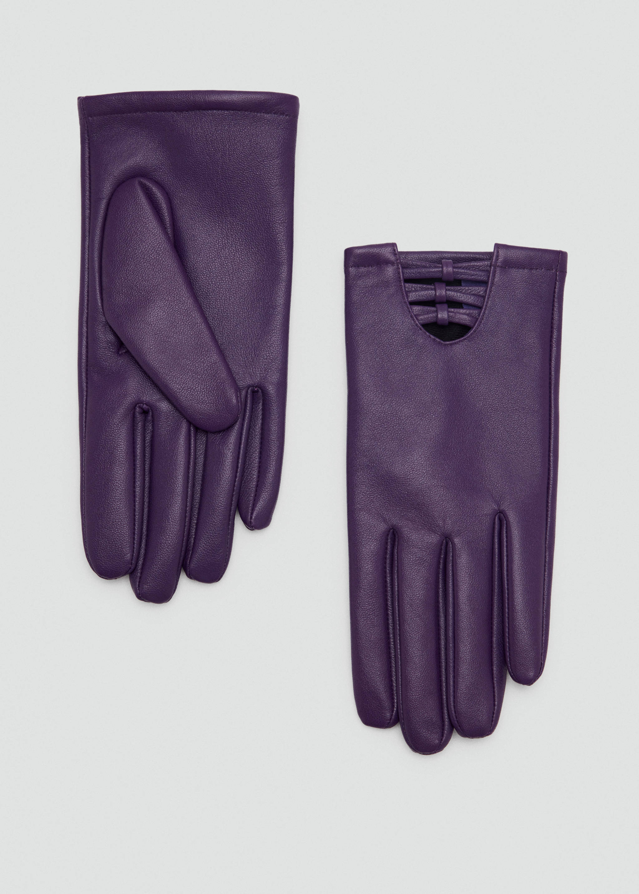 Purple leather gloves with a woven wrist detail on a plain background.
