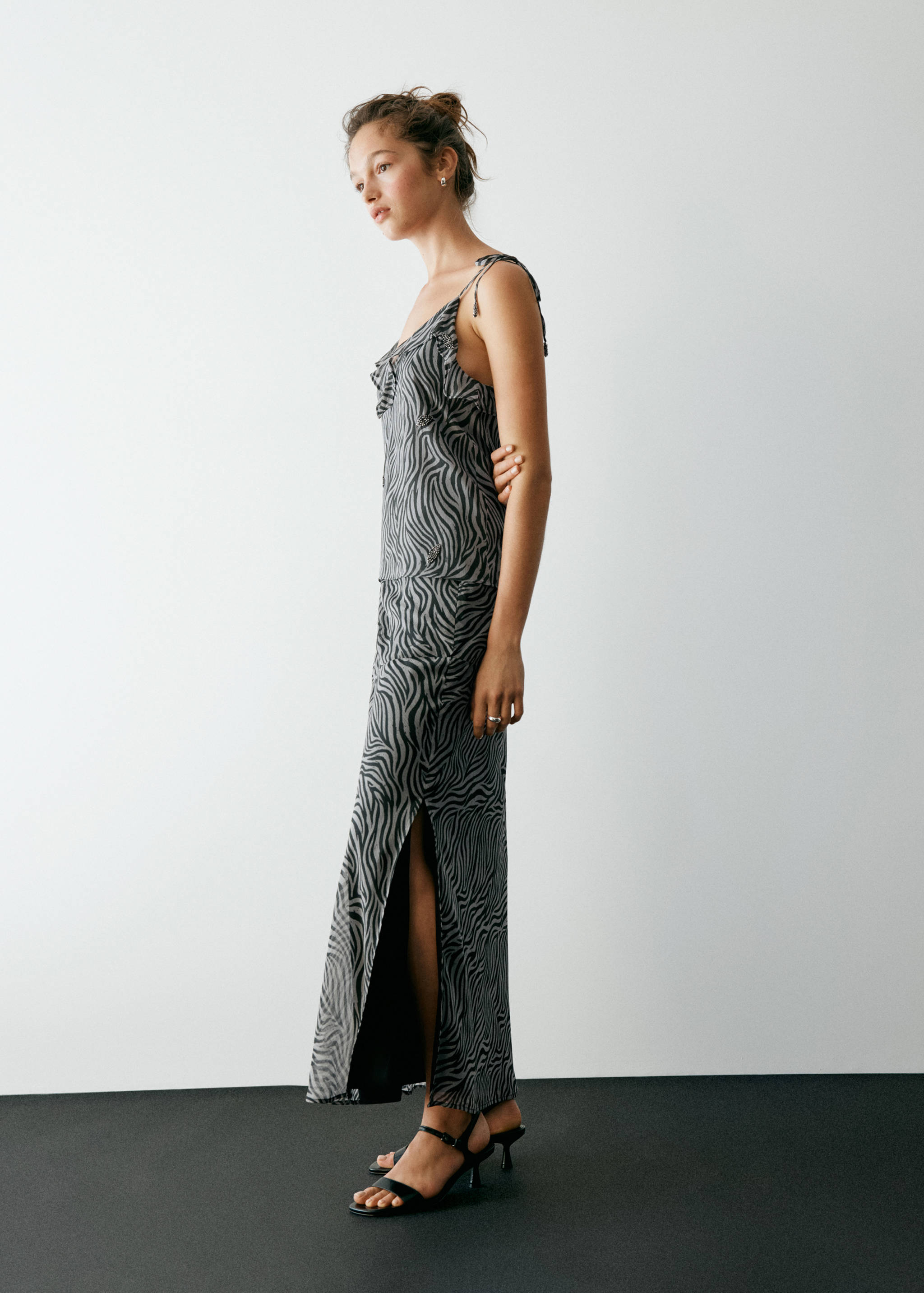 Black and grey zebra print long skirt with a high side slit.