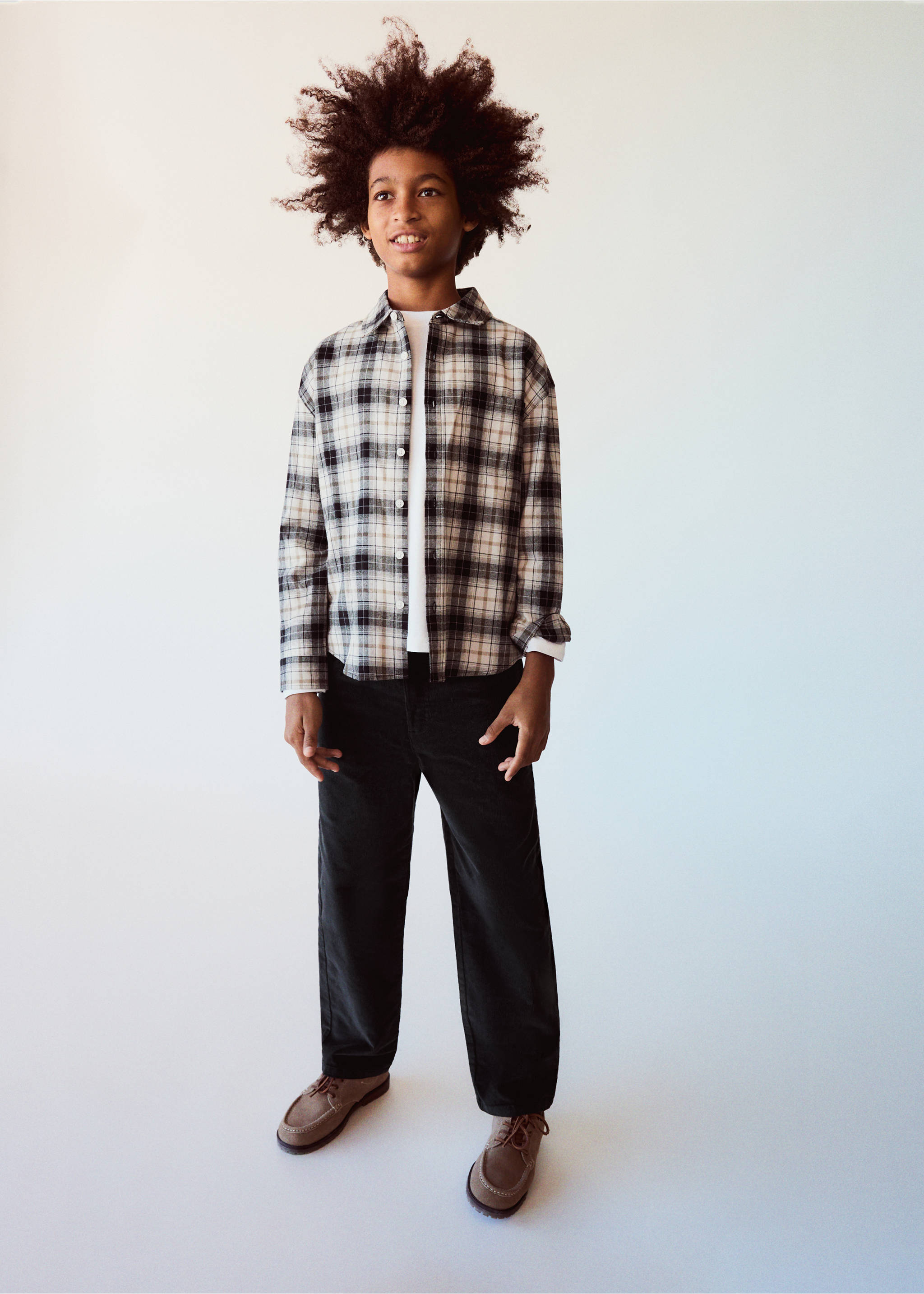 Neutral plaid shirt worn over a white t-shirt with dark trousers., Charcoal. Ref: 37067911-00.