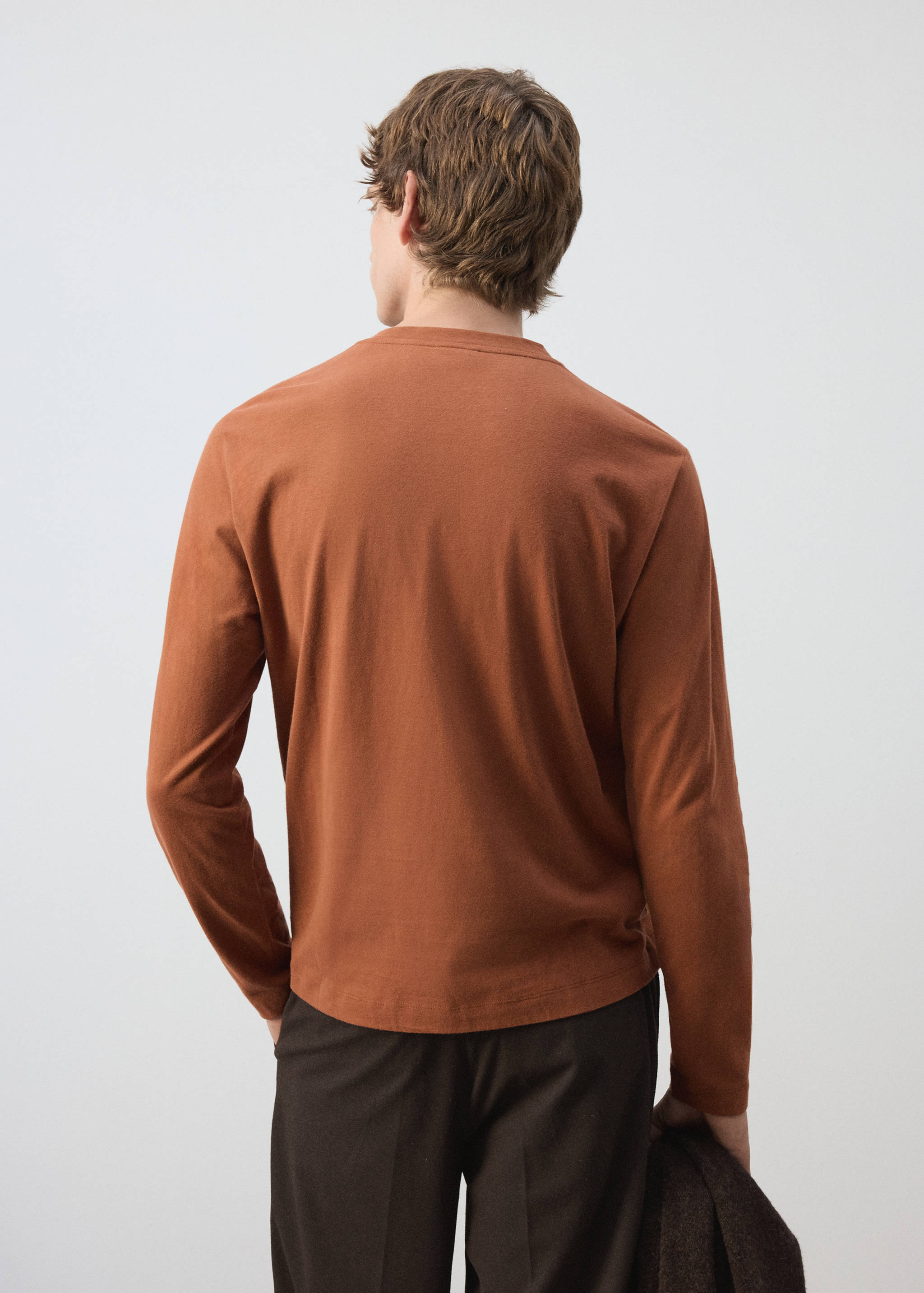Rust brown long-sleeve t-shirt with a crew neck, back view.
