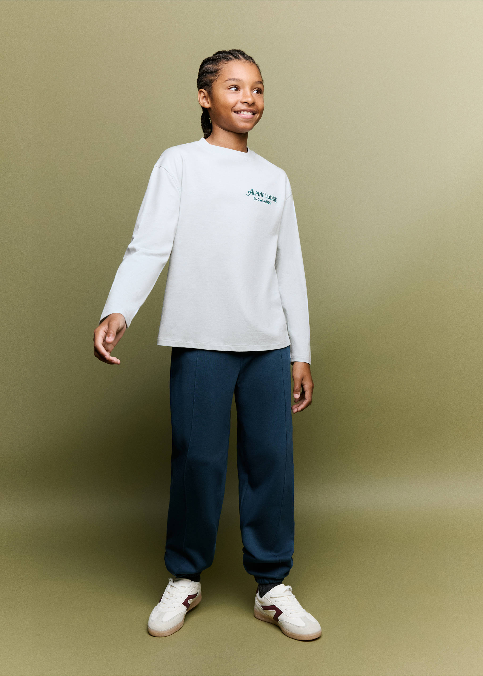 Dark blue trousers with front seams and cuffed hems, worn with a light grey t-shirt., Navy. Ref: 37067913-00.