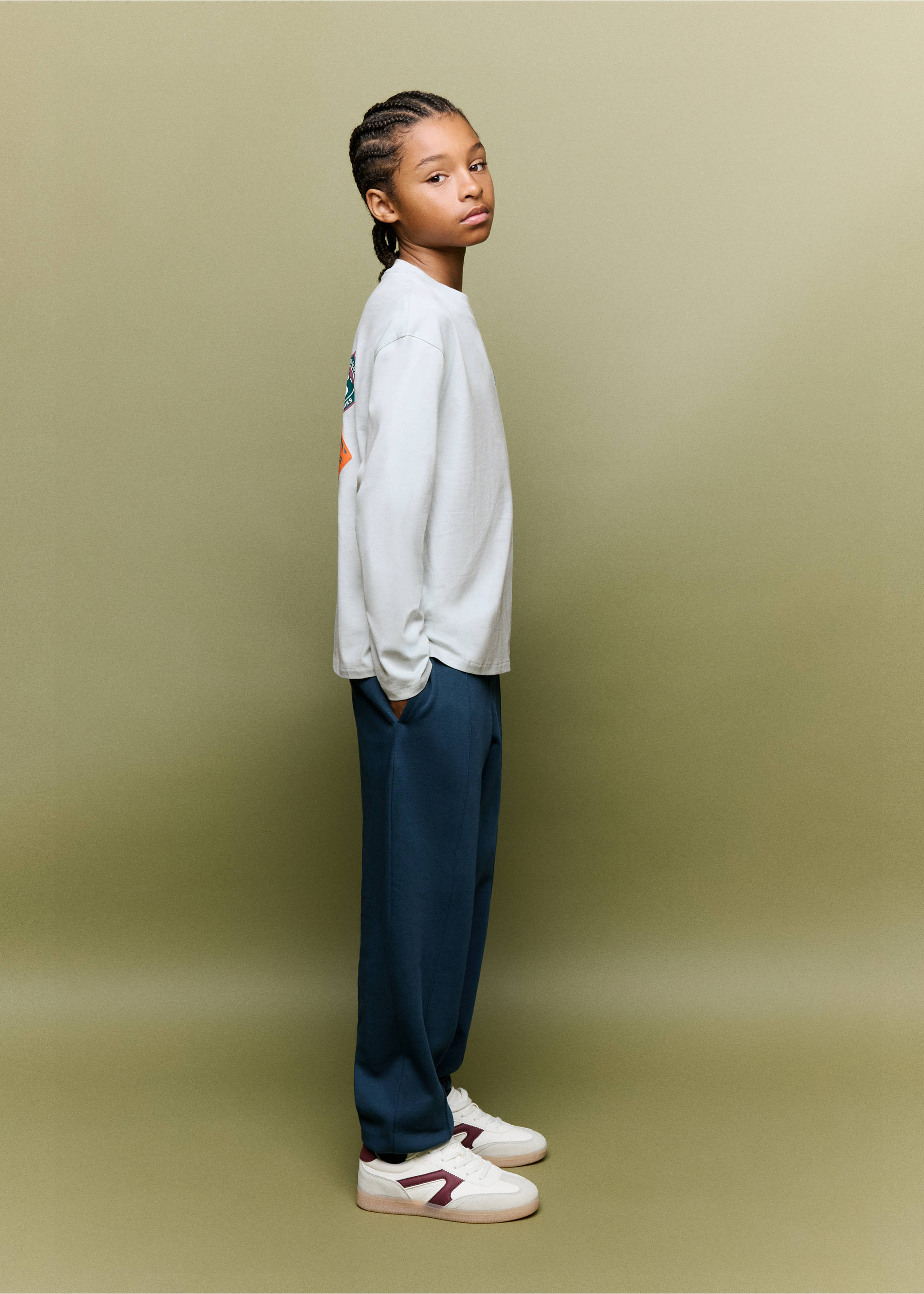 Dark blue trousers with a relaxed fit and straight legs, worn with a light grey long-sleeve t-shirt., Navy. Ref: 37067913-00.