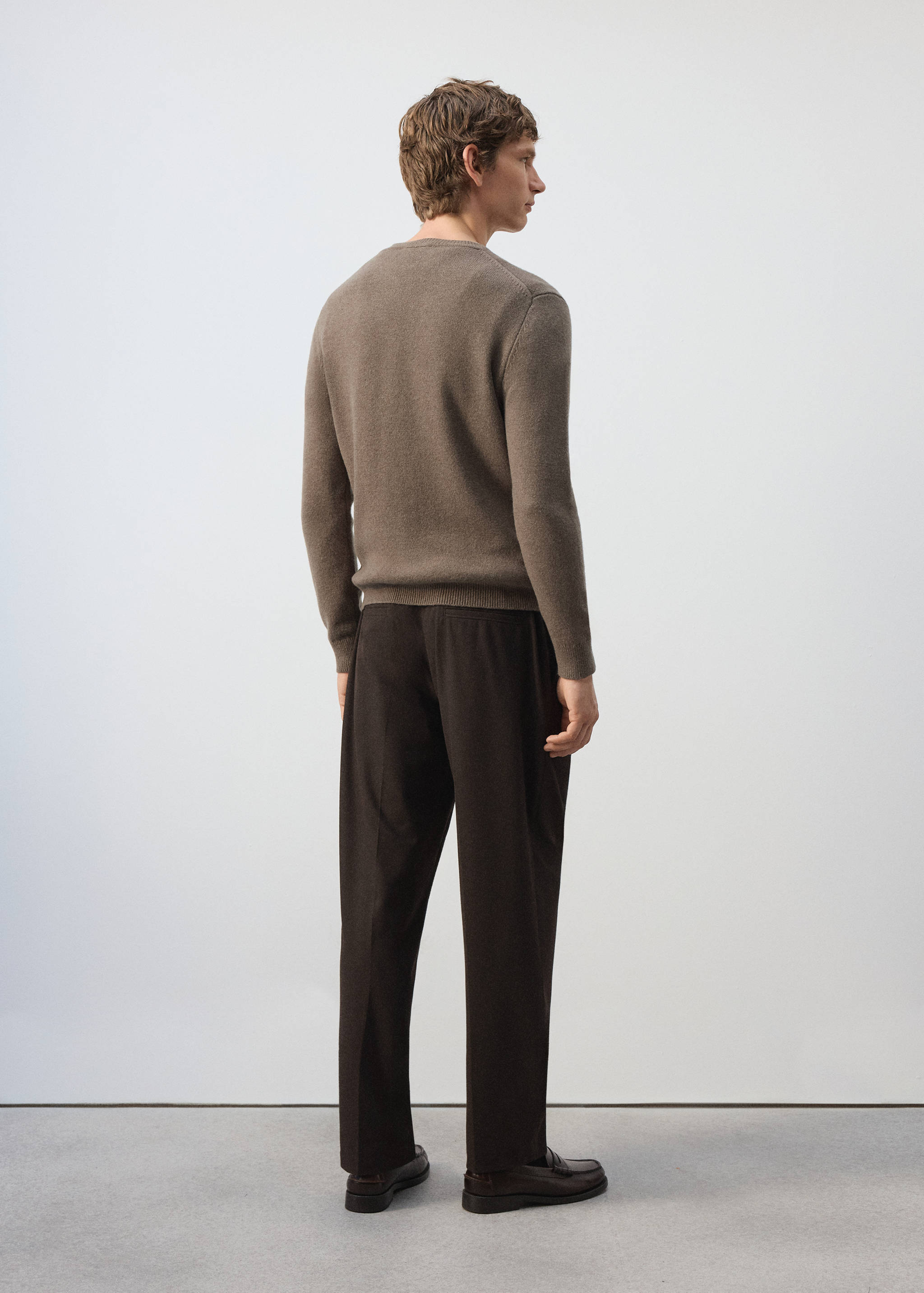 Brown crew neck knitted jersey, back view.
