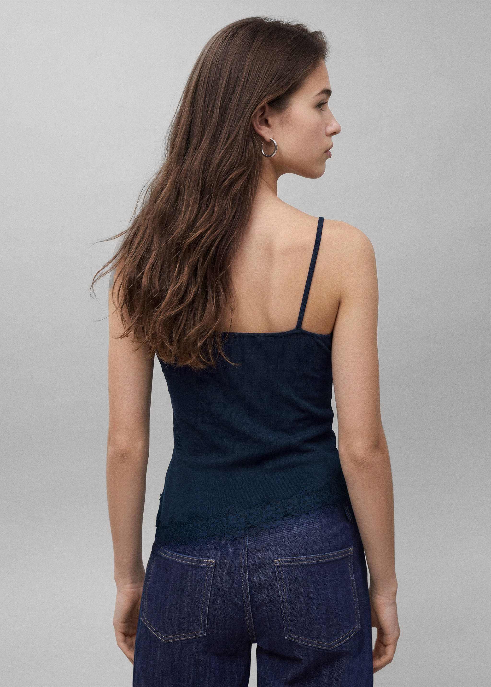 Navy blue lace-hem camisole top, back view.